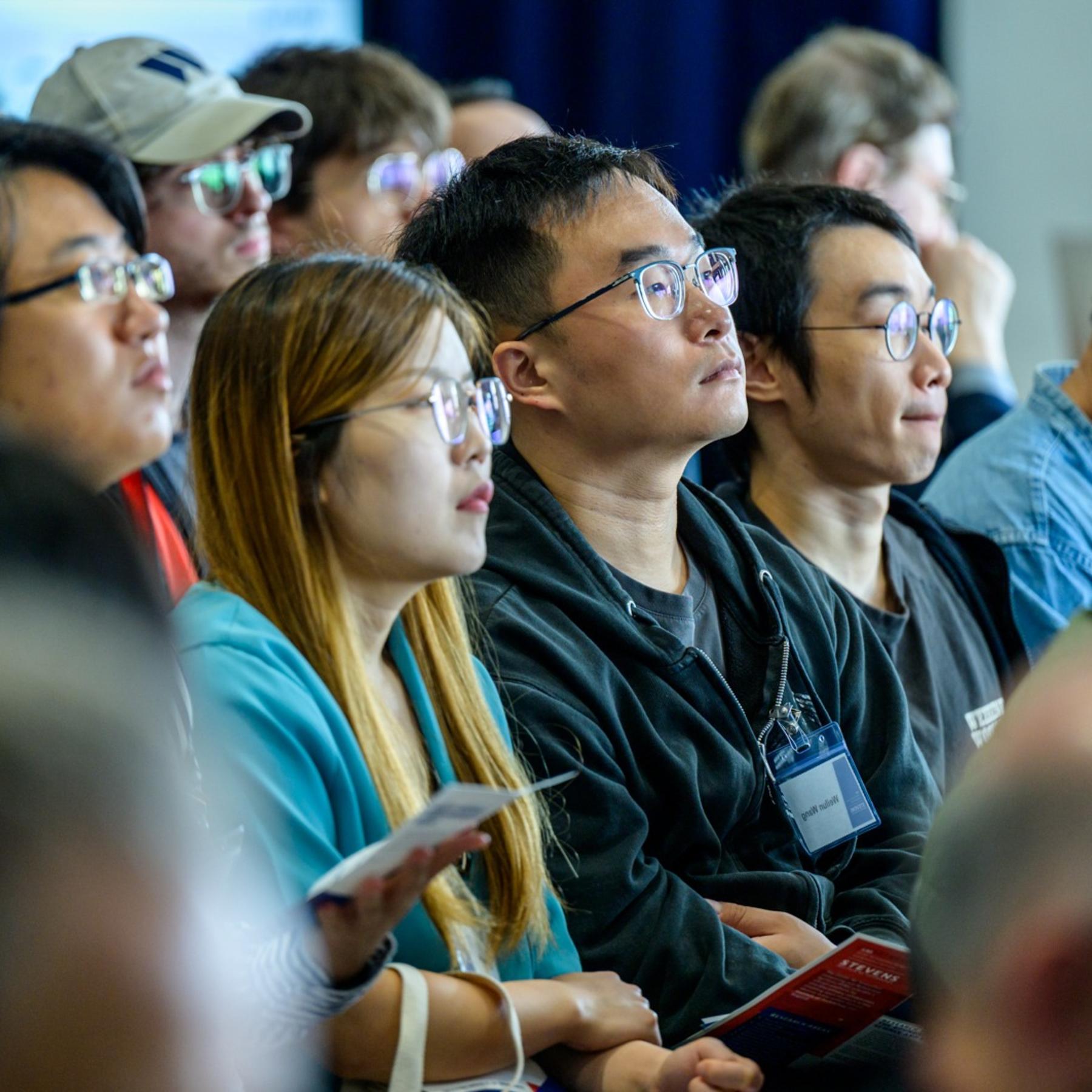 Audience members seated during a presentation at the iCNS Launch.