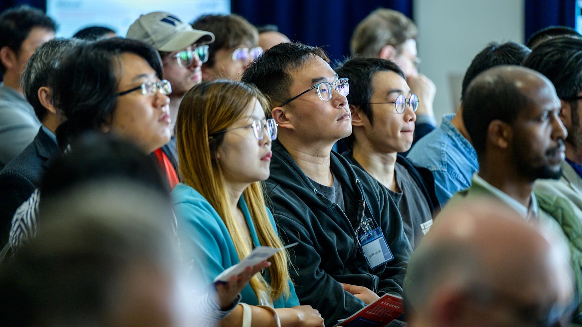 Audience members seated during a presentation at the iCNS Launch.