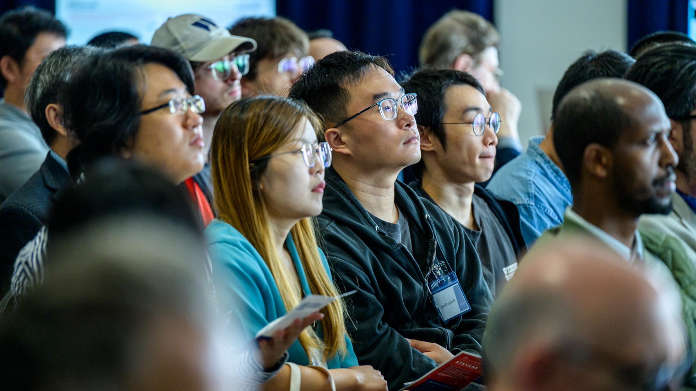 Audience members seated during a presentation at the iCNS Launch.
