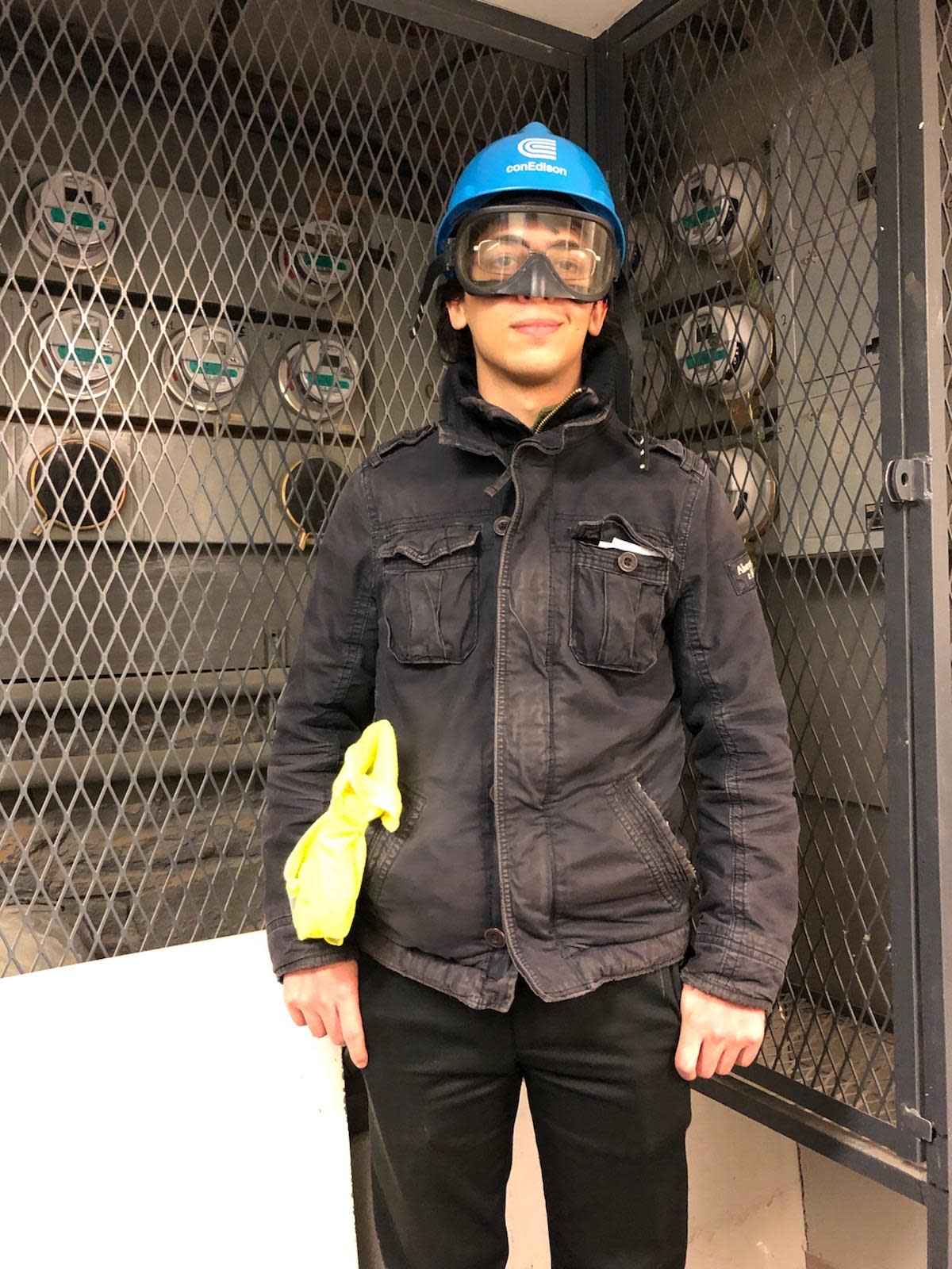 A photo of Angel Burgos '23 amid research equipment in the Kim Lab