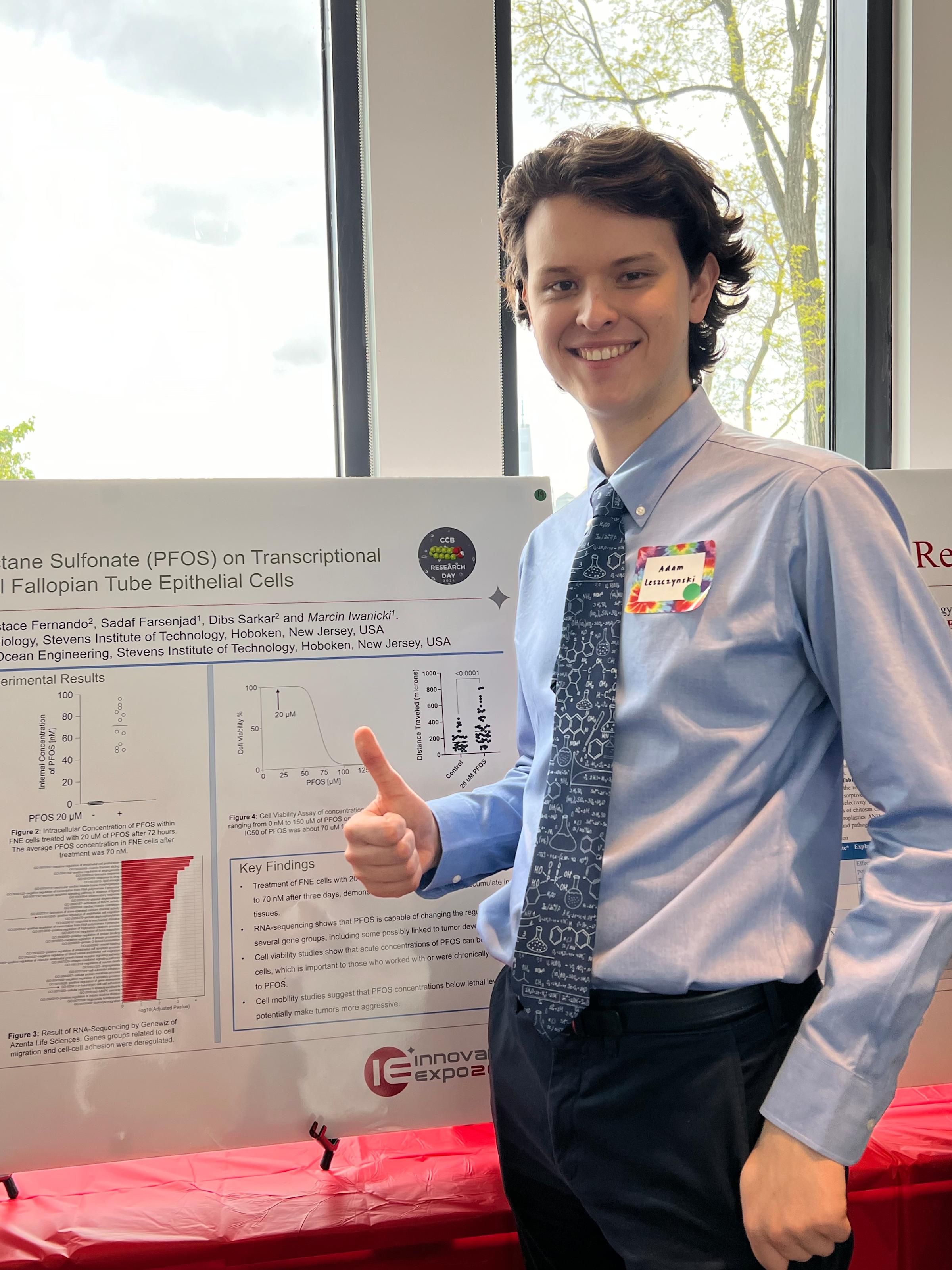 Adam Leszczynski in front of his poster at the 2024 Innovation Expo