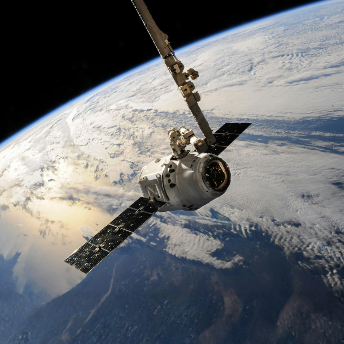 White Outer Space Satellite above Earth.