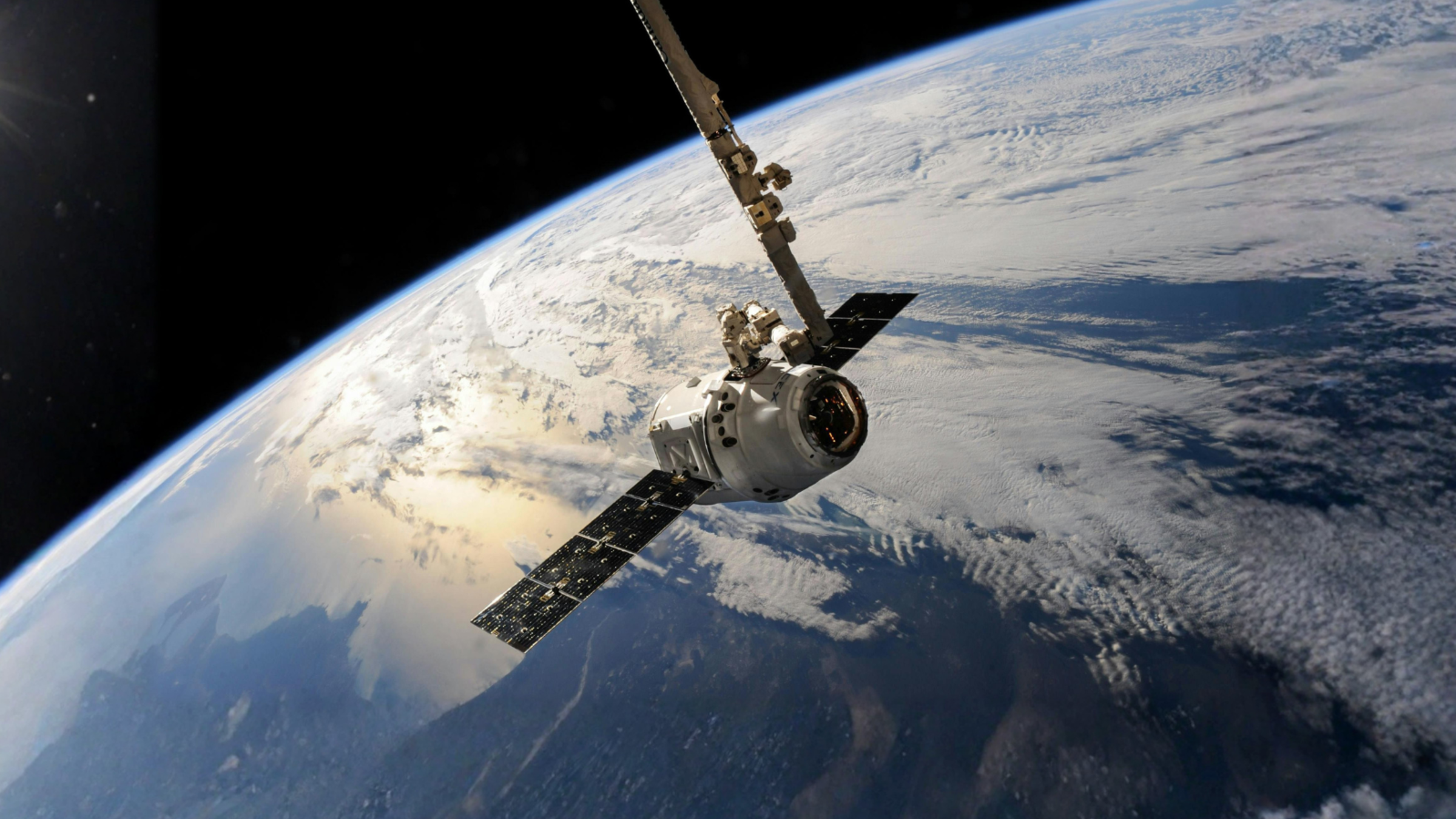 White Outer Space Satellite above Earth.