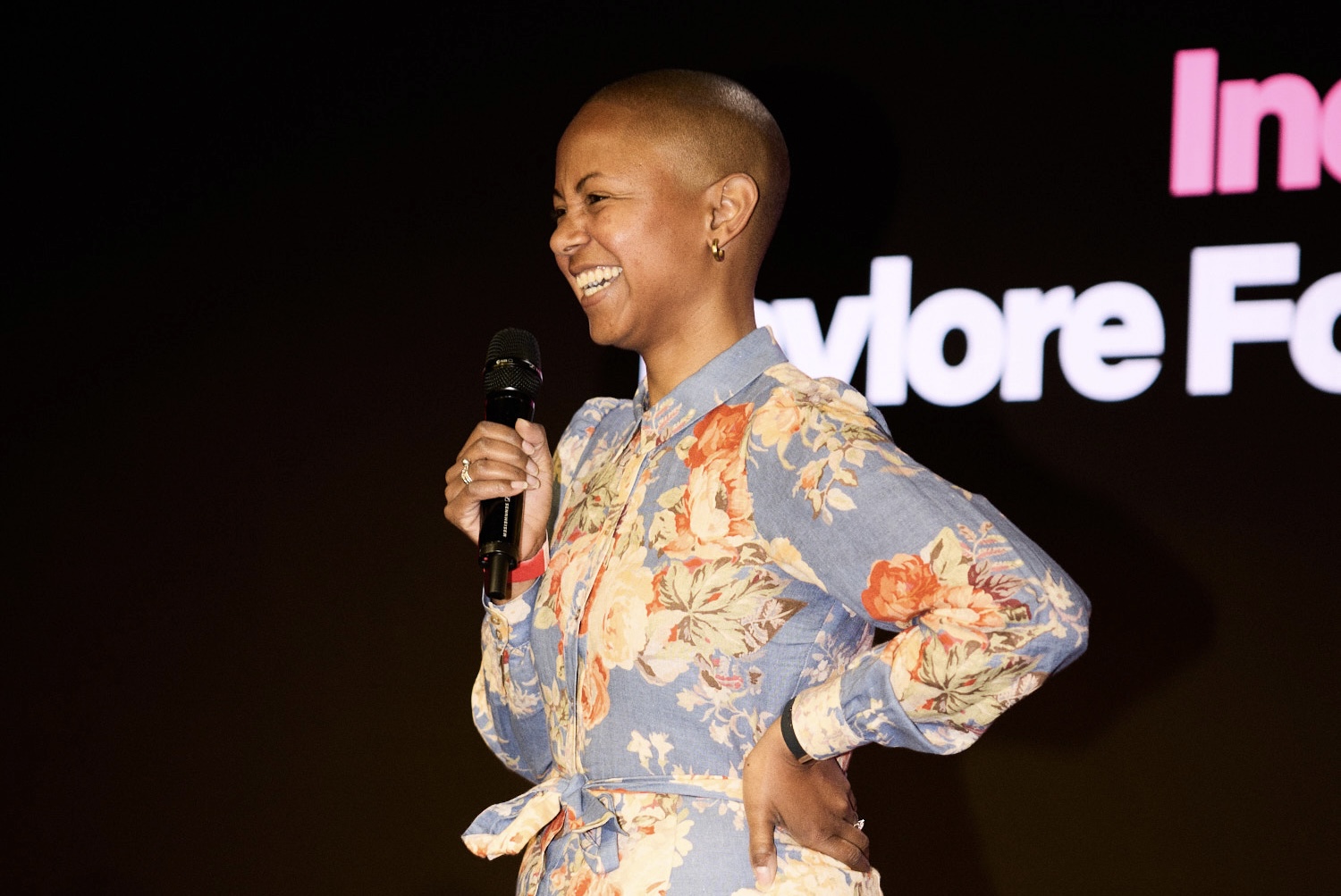 Taylore Fowler ’14 uses a microphone on stage