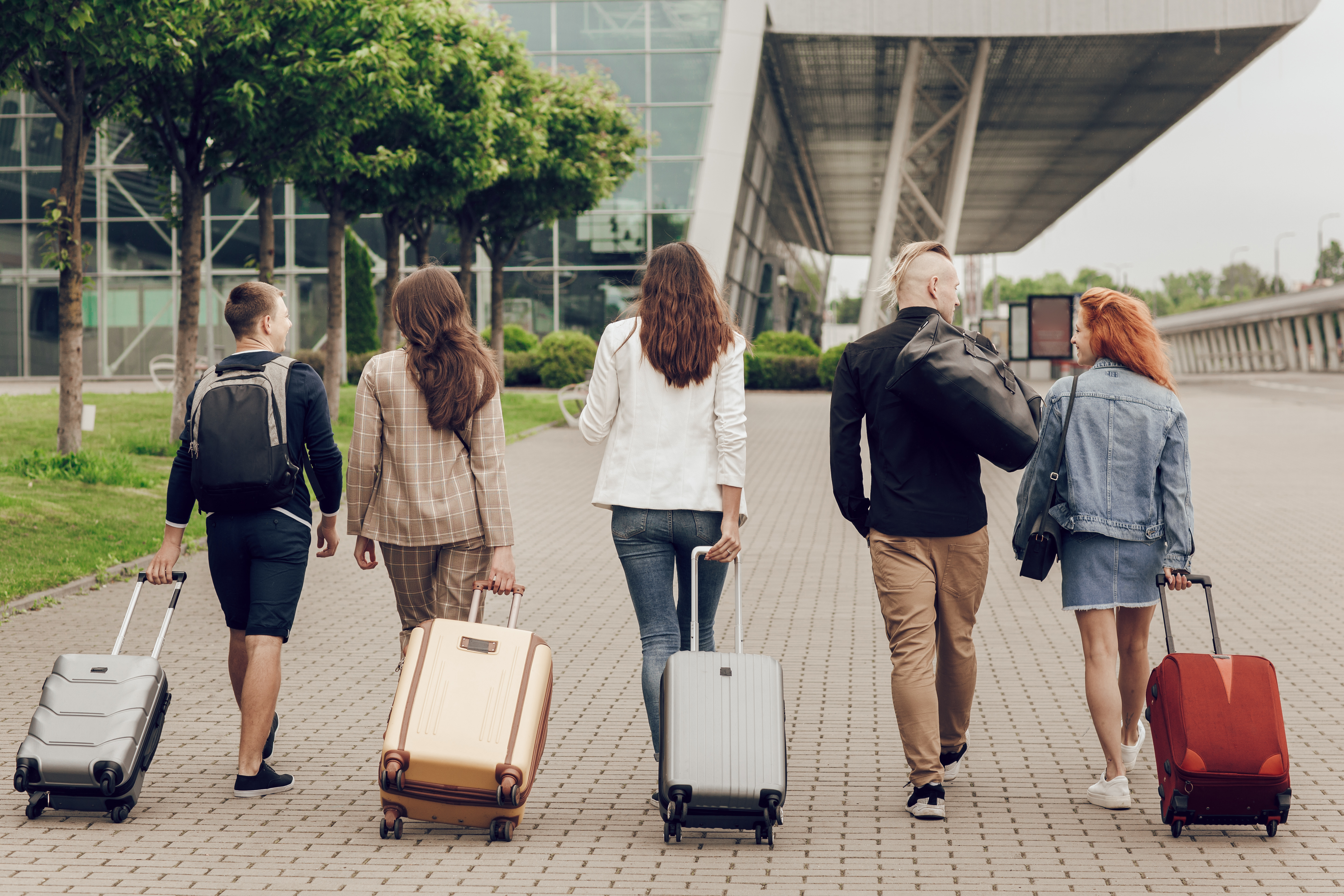 Students at airport with luggage