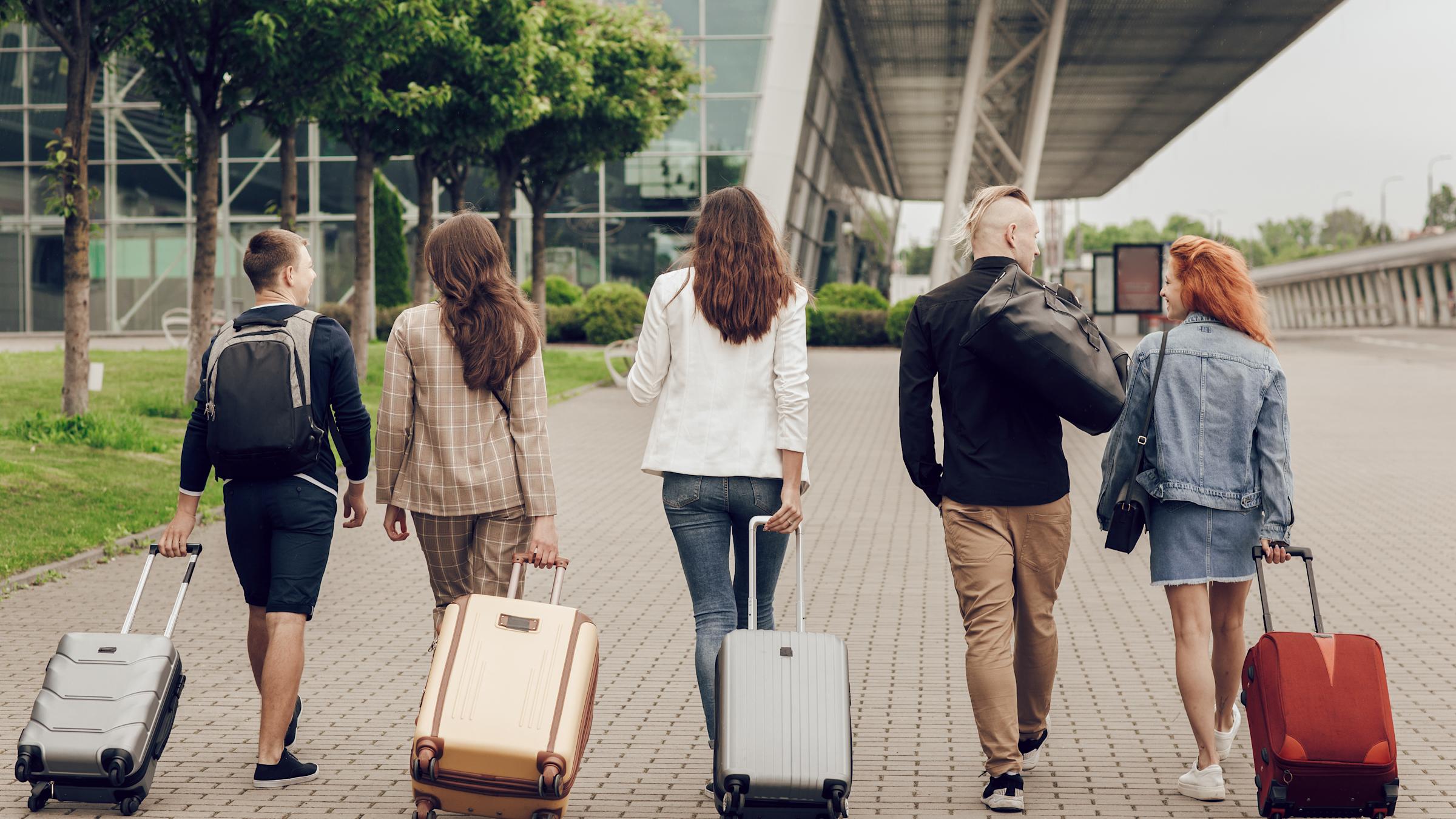 Students at airport with luggage