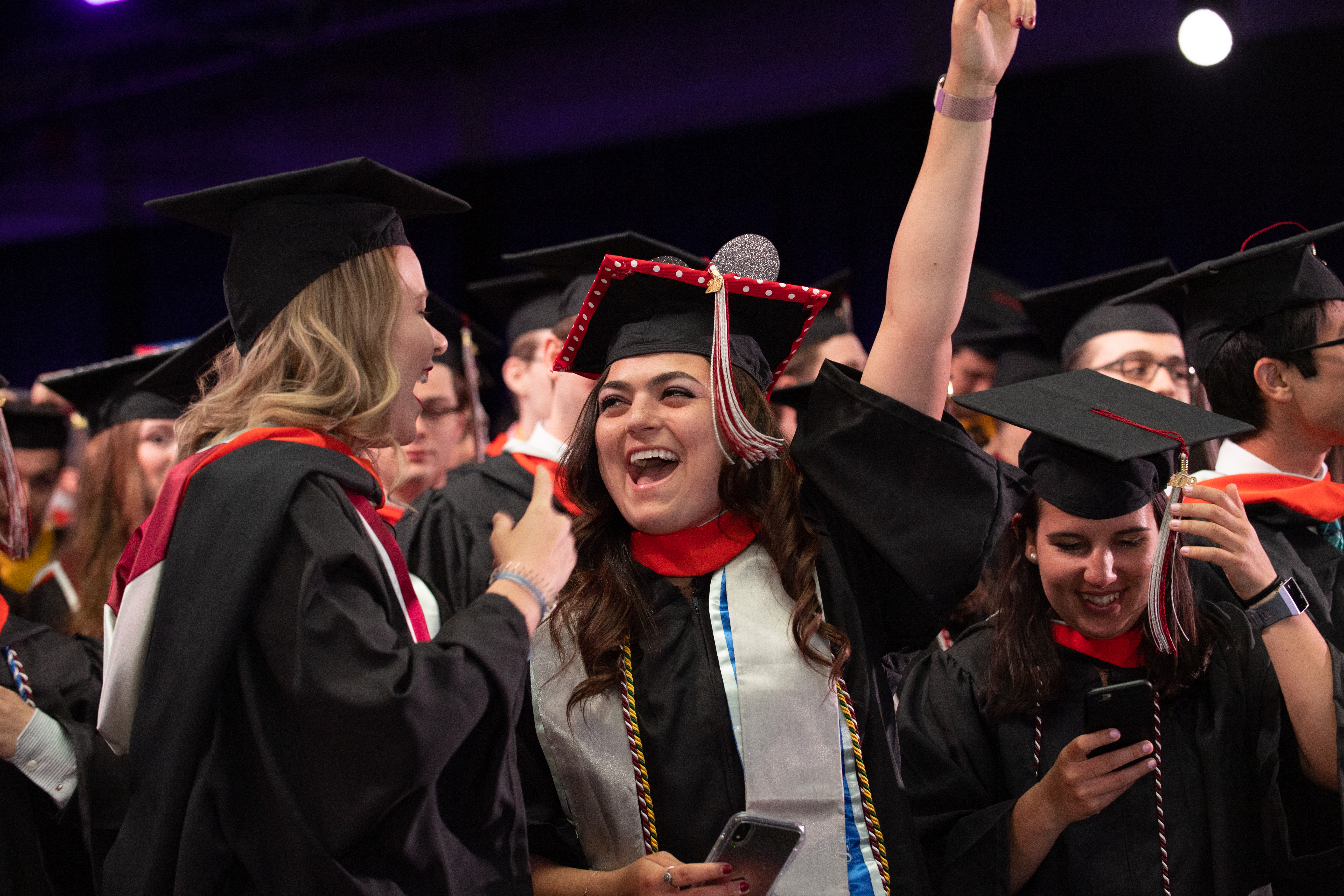 Students celebrate graduation with a big smile.