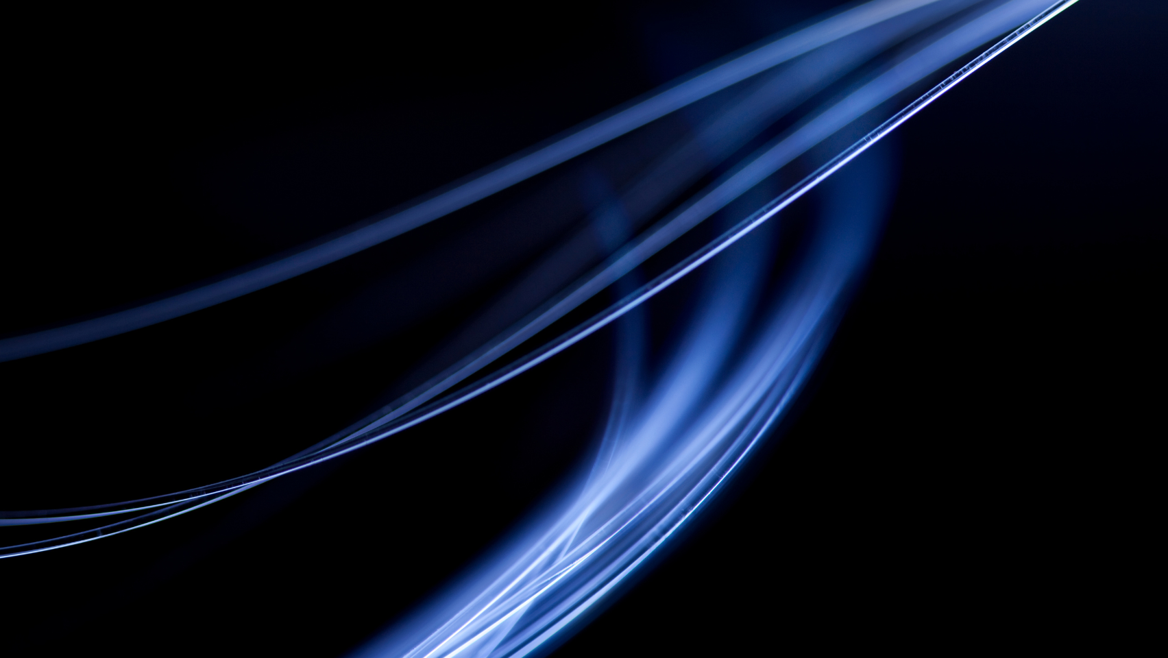 blue light bent by optical fibers