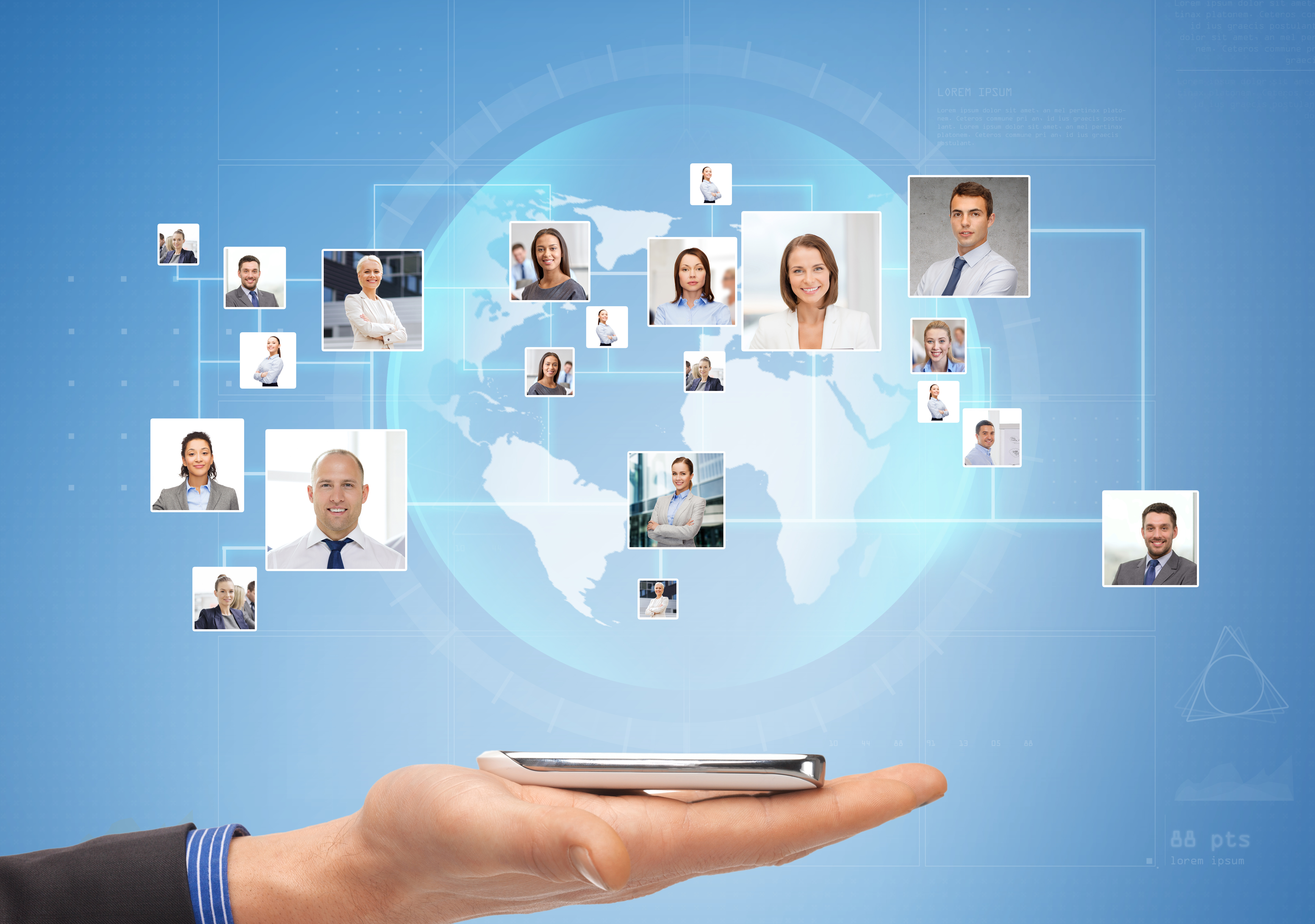 Hand holding smartphone with holographic display showing world map and floating portrait photos of diverse business professionals connected by network lines, representing global digital communication.