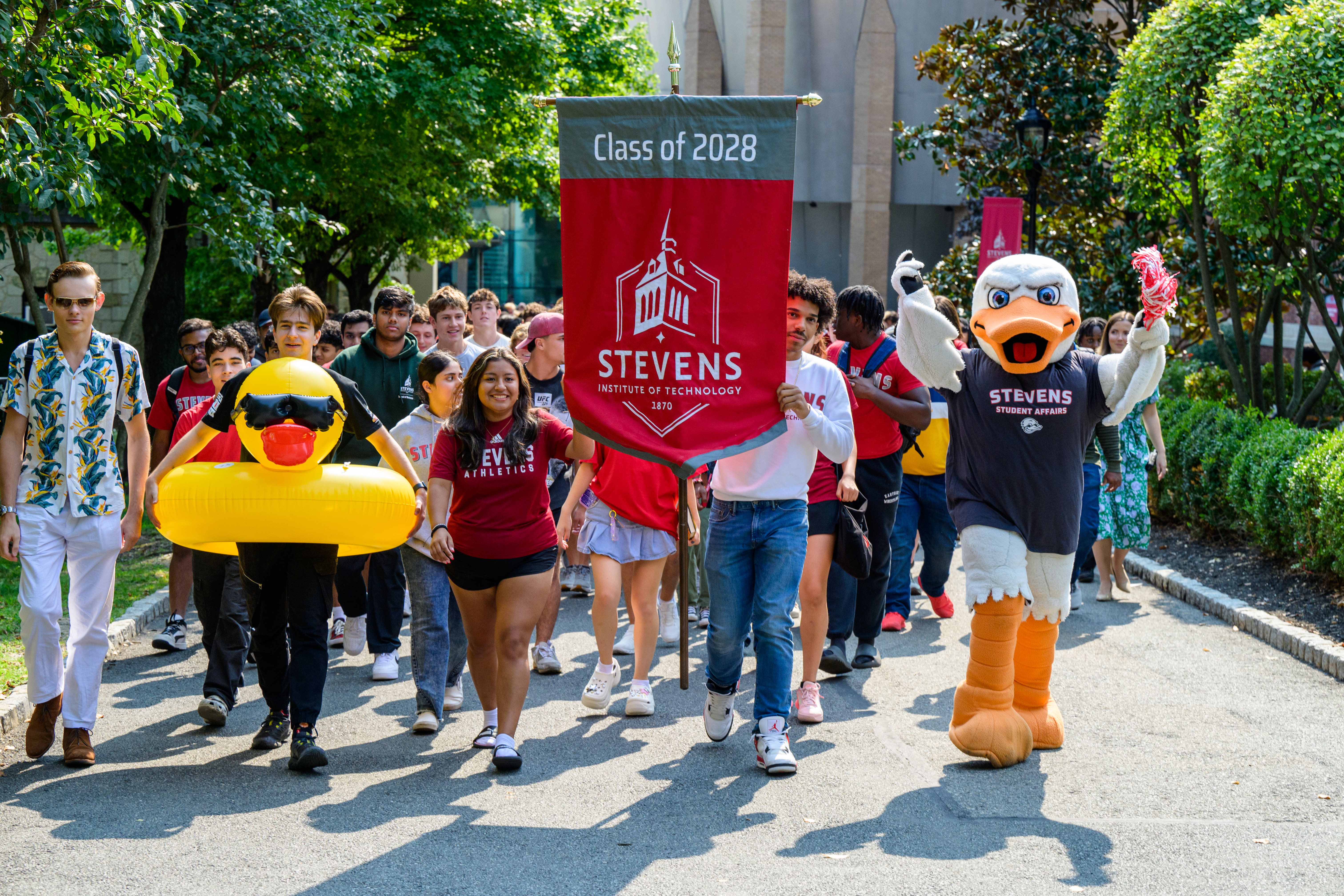 The incoming Class of 2028 with banner and Attilla at Wittpenn Walk