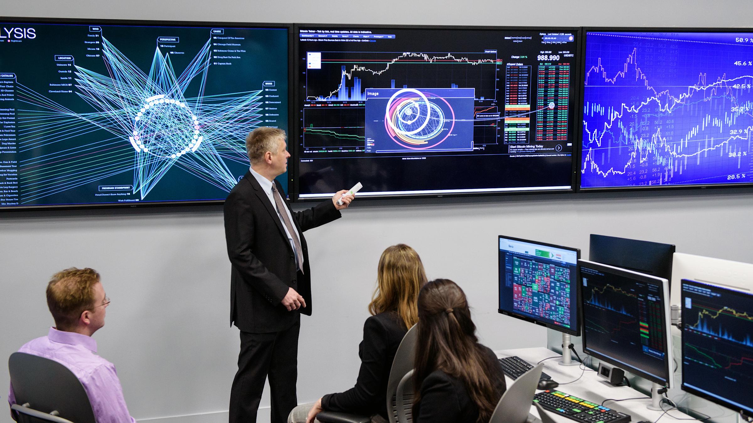 Student listens to instructor, thoughtfully