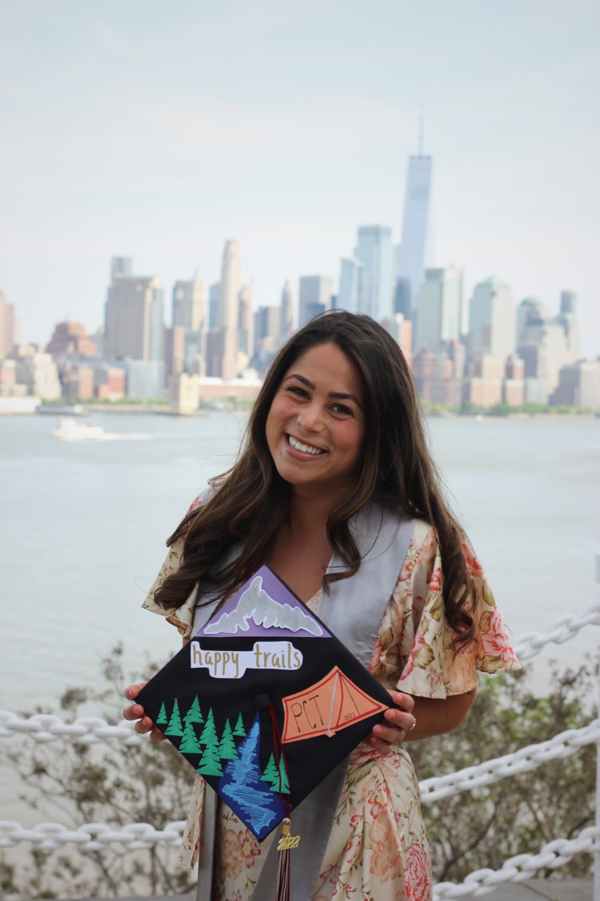 Brynn Froehlich holds decorated graduation cap at Castle Point