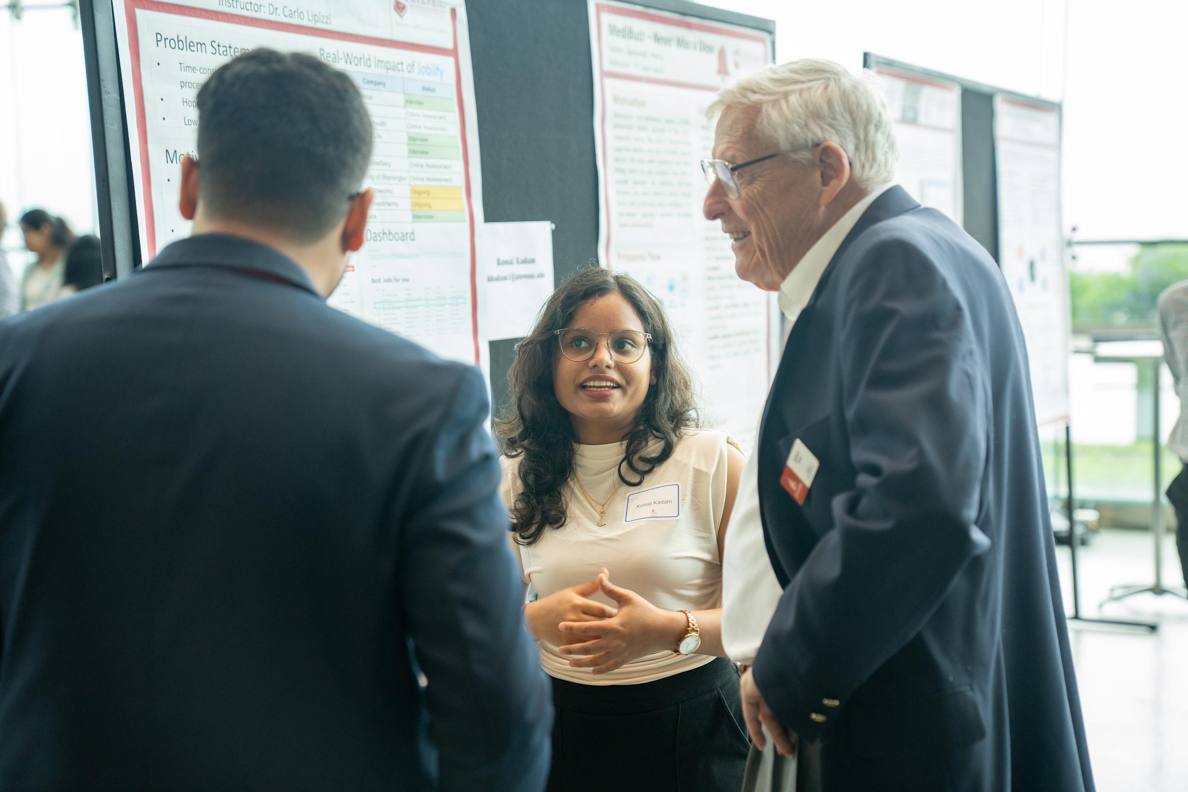 Professor Stohr speaking with students