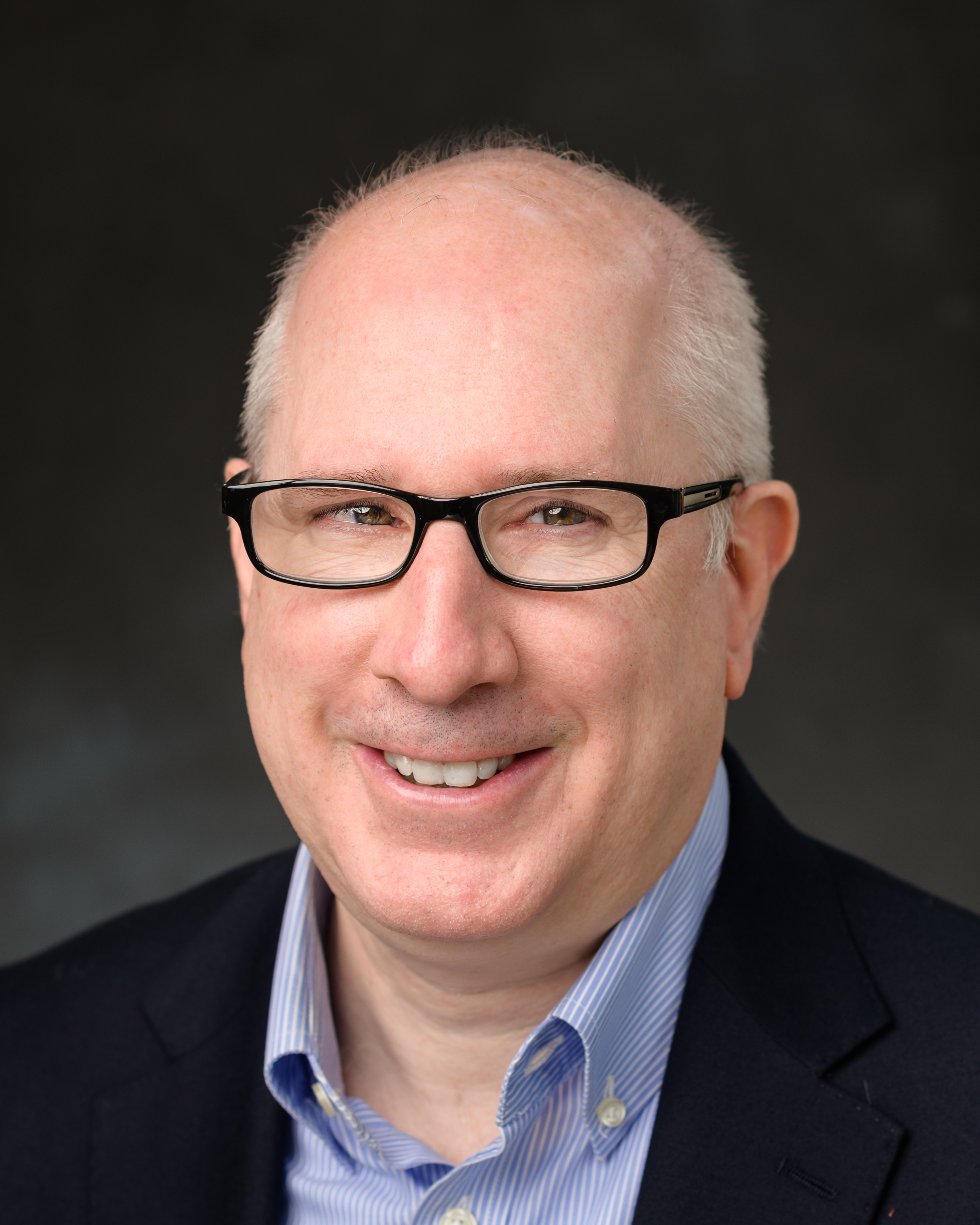 A headshot of Michael Hofmann, our Senior Brand and Graphics Manager