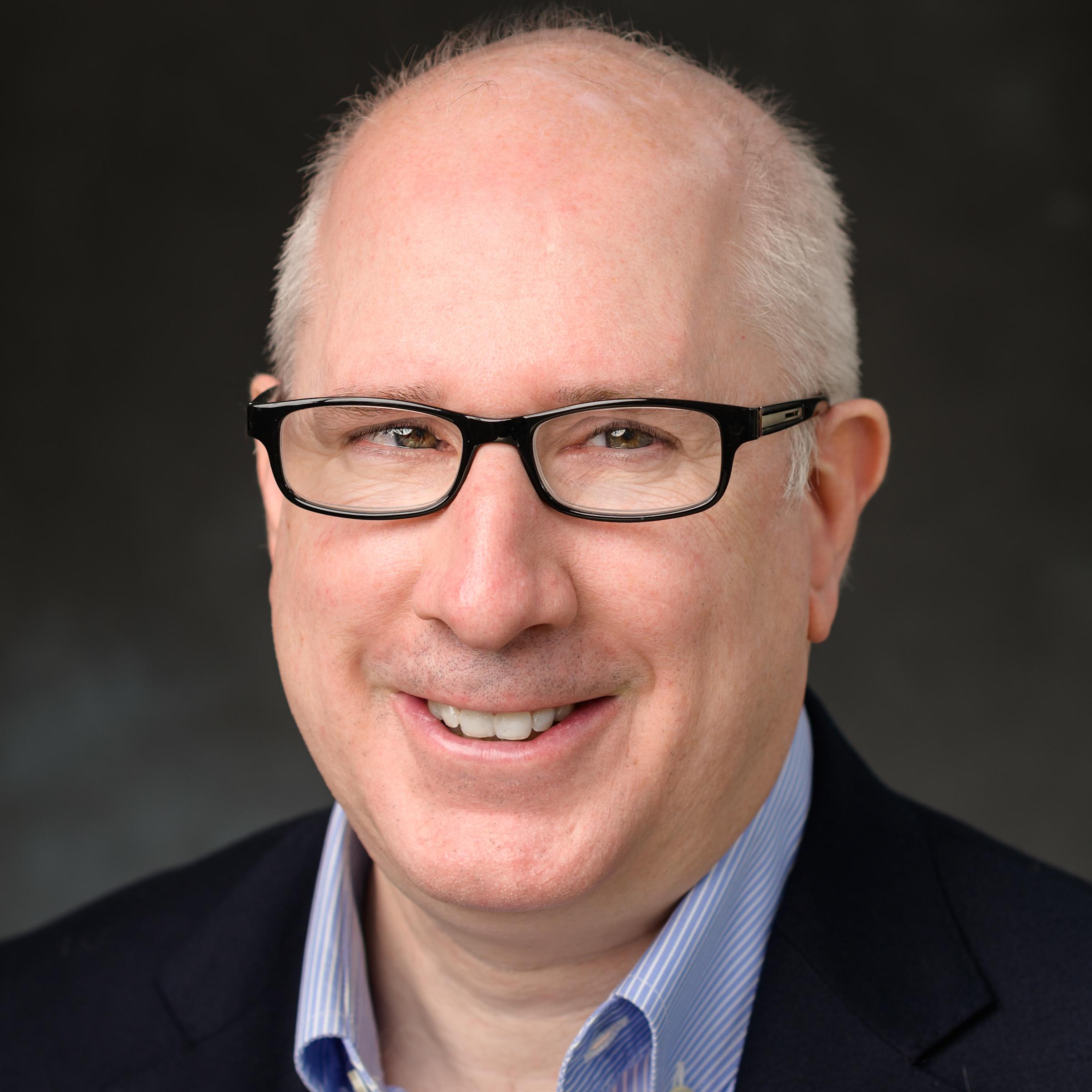 A headshot of Michael Hofmann, our Senior Brand and Graphics Manager