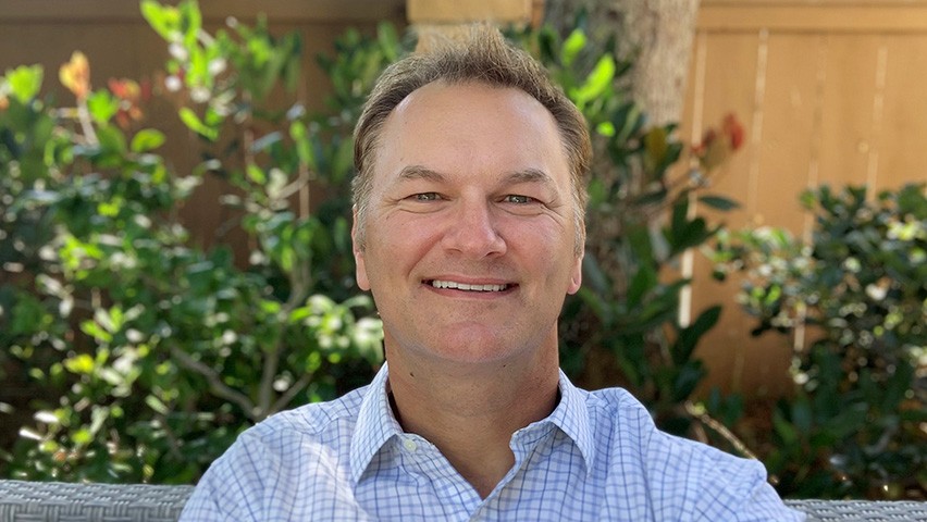 Portrait of Craig Sem in an outdoor setting.