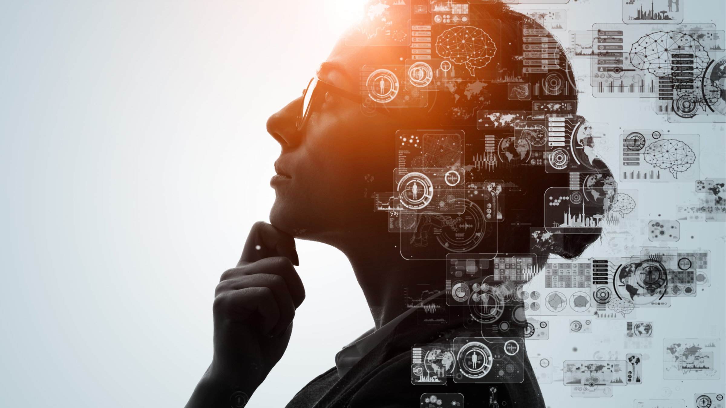 Silhouette of a person with a digital overlay of data and brain imagery, suggesting artificial intelligence or data processing.