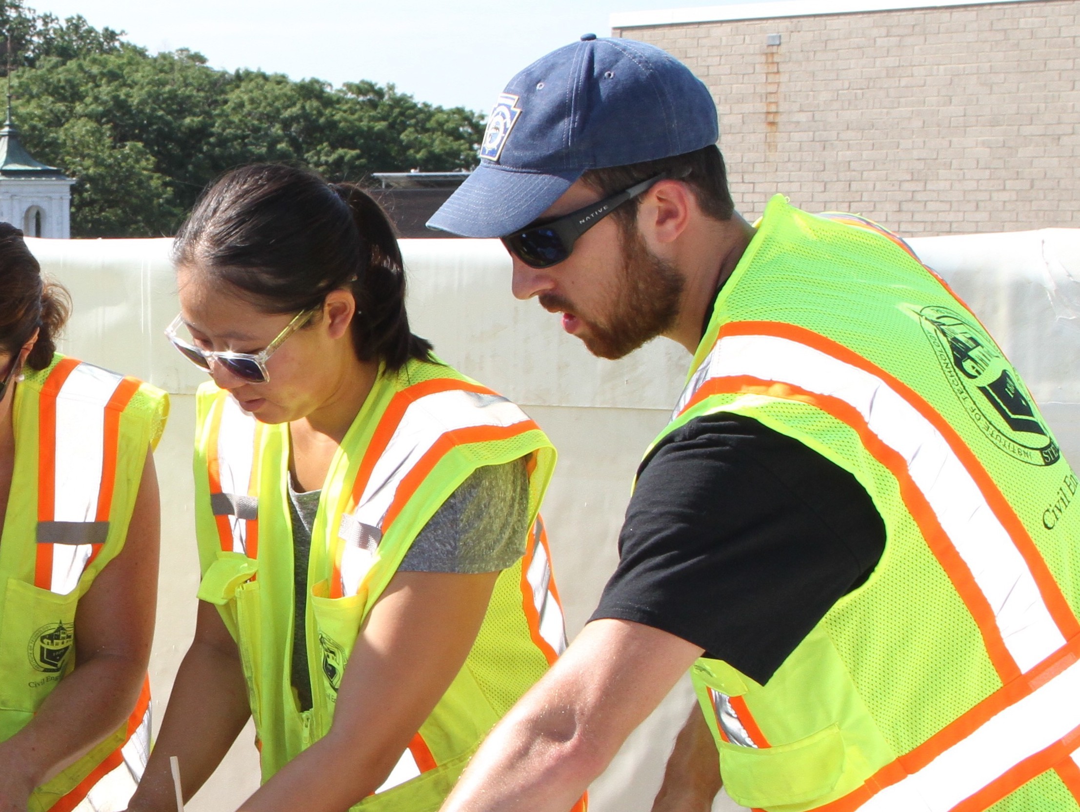 Students and faculty working on a rooftop