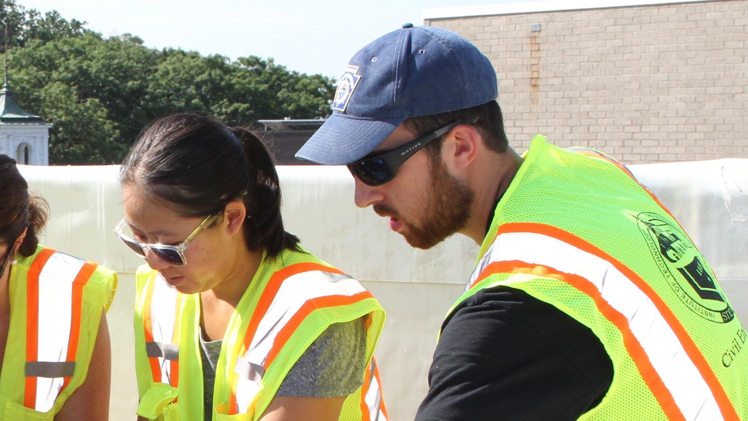 Students and faculty working on a rooftop