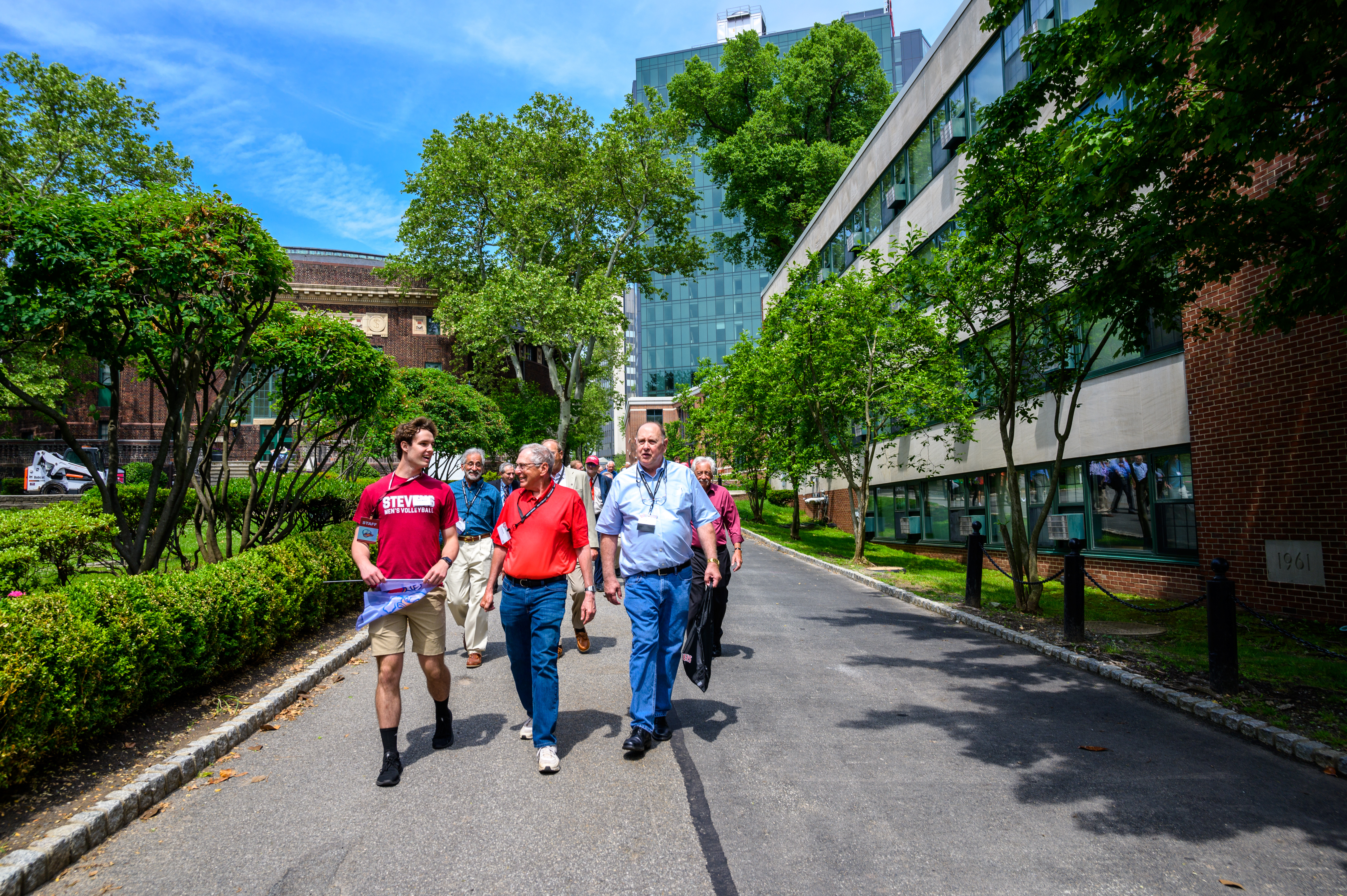 Student guide and alumni walk down the Wittpenn walk.