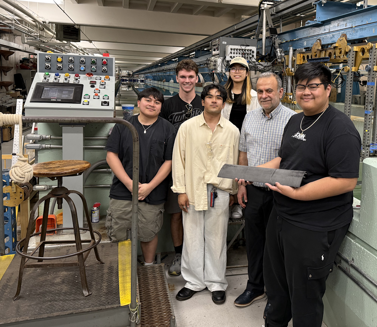 Benedict Martinez, Andrew Vallent, Jess Irvin Peleo, Alyson Zhang, faculty advisor Muhammad Hajj and John Figueras stand with their work in the Davidson Lab.