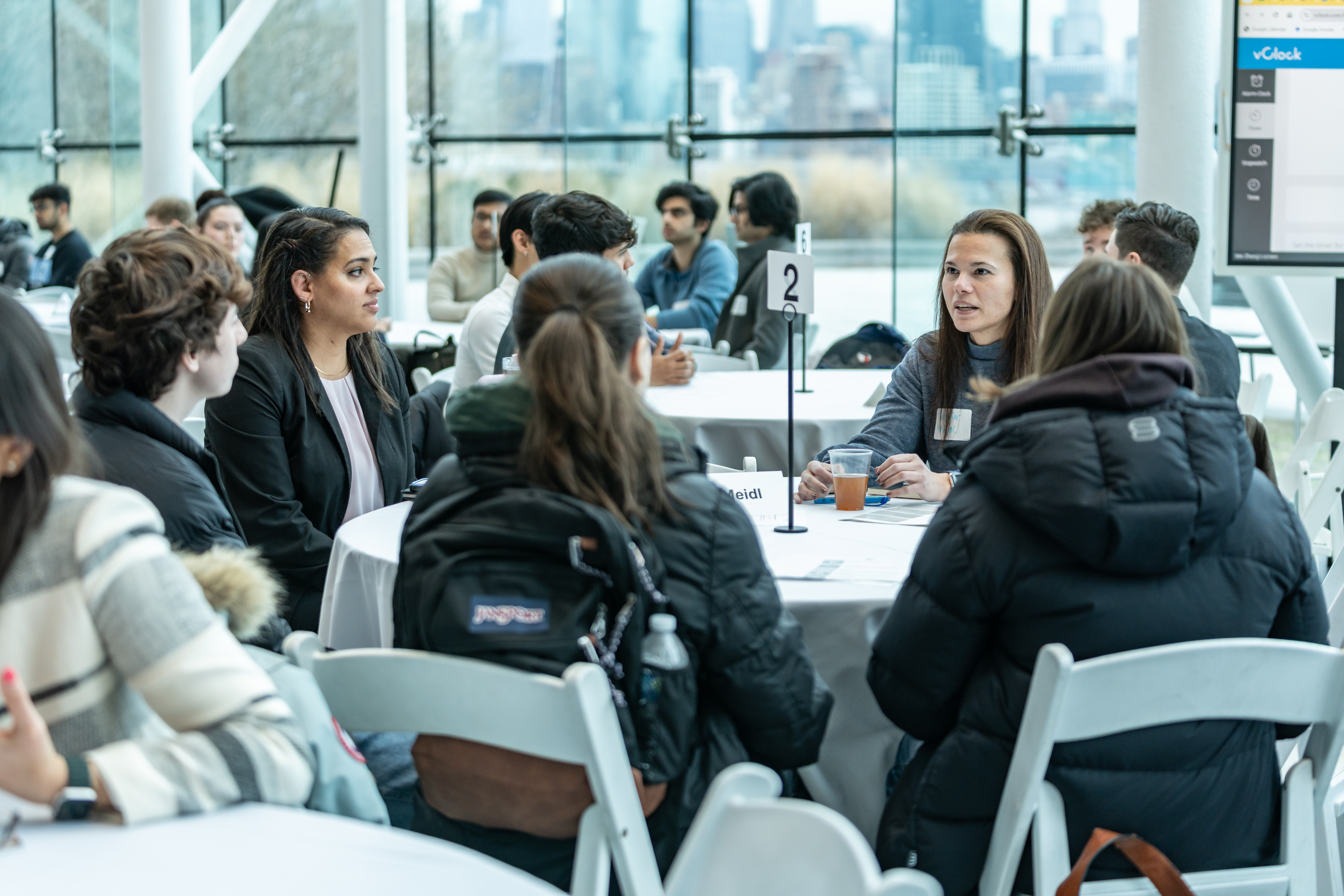 Group of participants engage with a Stevens alumnus