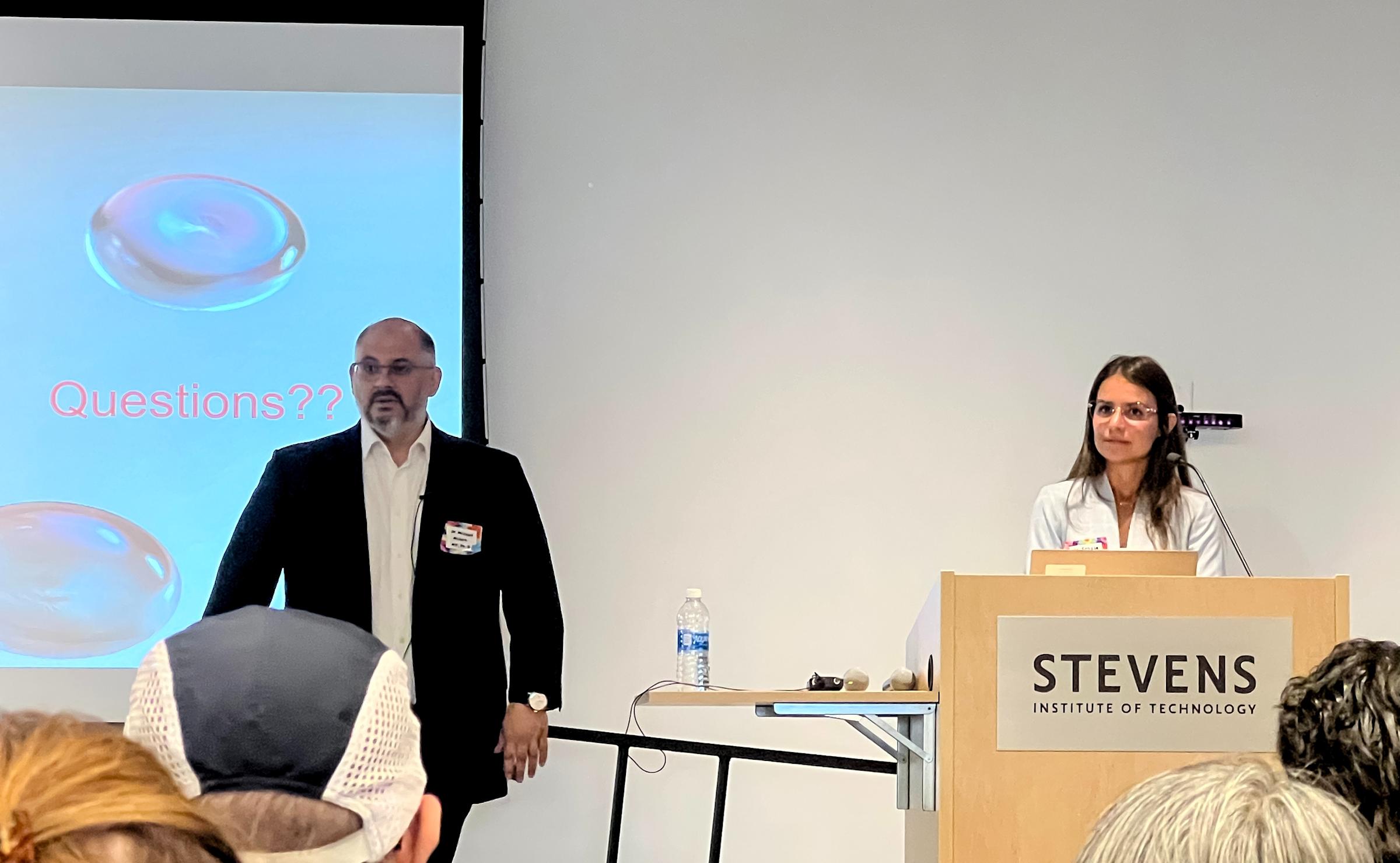 Michael Milone standing with Felicia Spadavecchia at a podium.