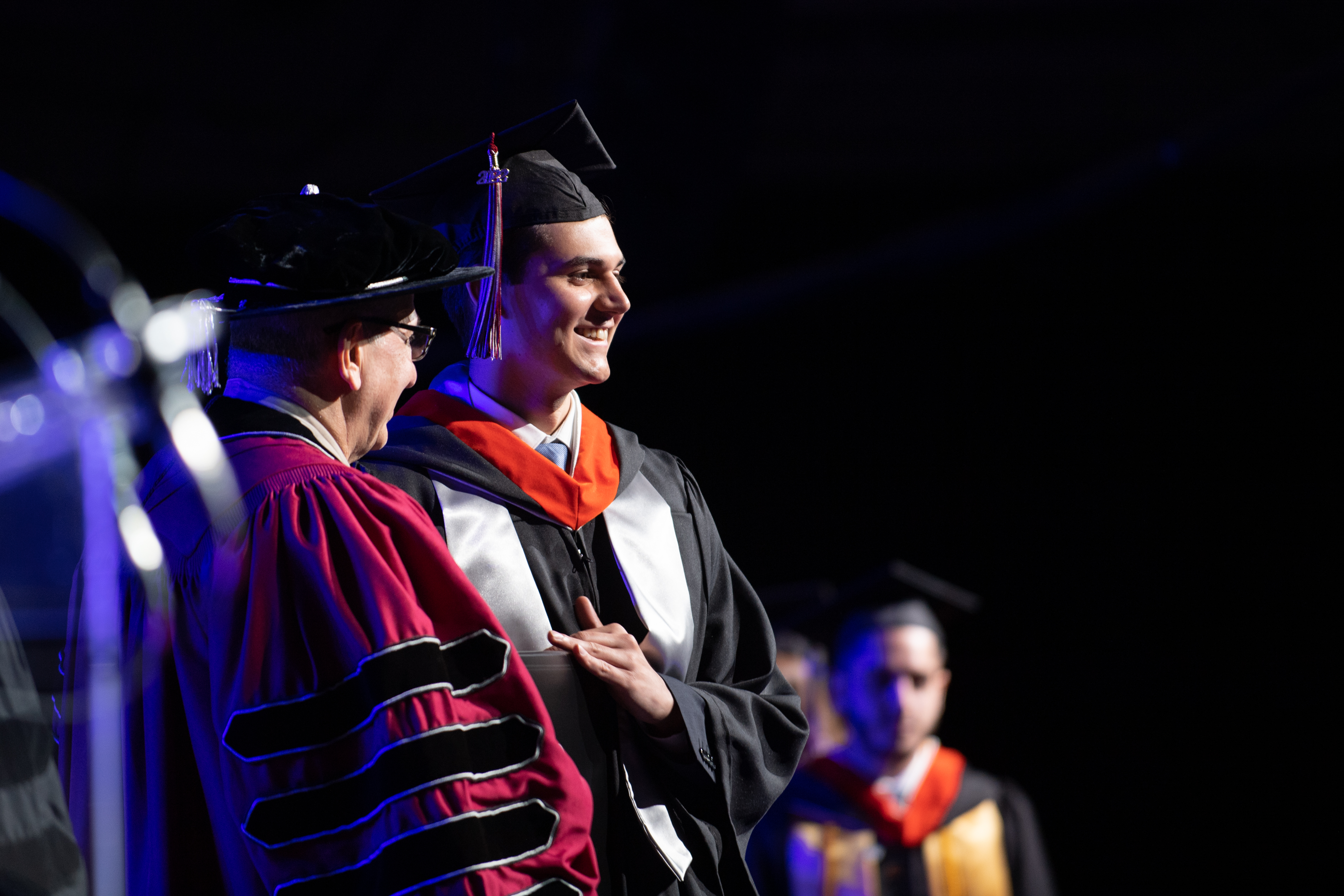 A student received his diploma from Stevens President Nariman Farvardin at the 2022 Undergraduate Commencement Ceremony.