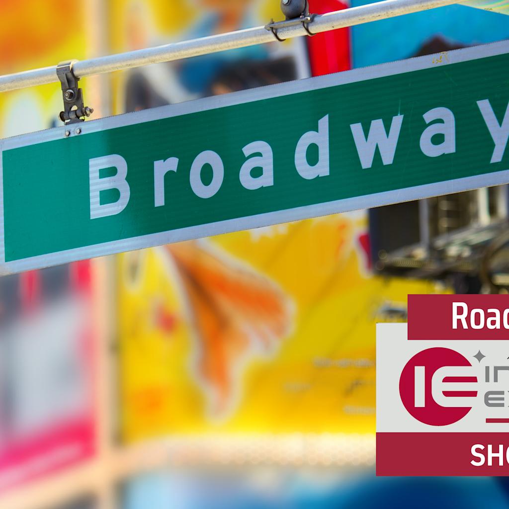 Close-up of a Broadway street sign with blurred colorful Times Square lights and billboards in the background. Stevens School of Business logo appears in the upper left. "Road to Innovation Expo 2026 - Showcase" branding is displayed.