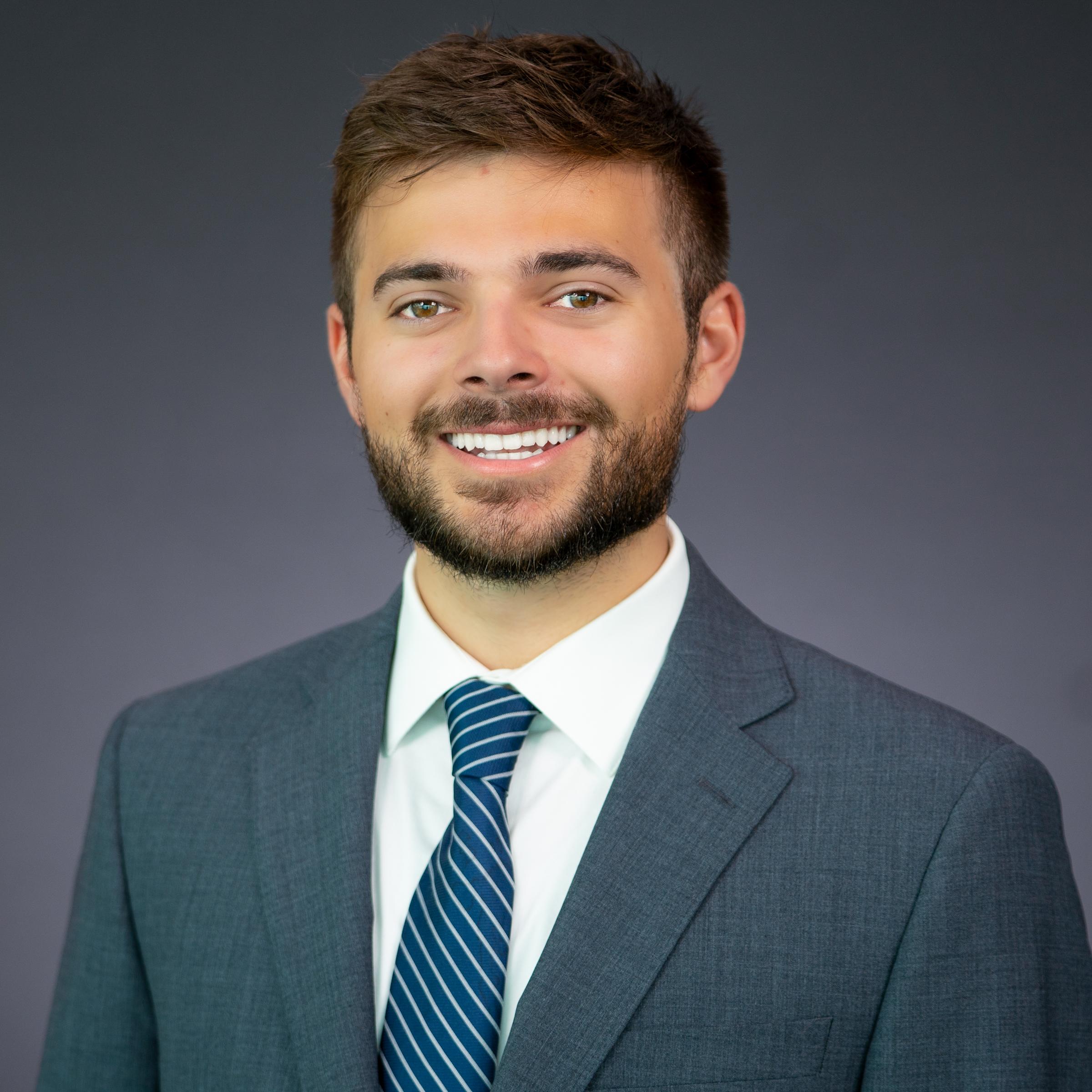 Headshot of Samuel Vacca wearing professional attire