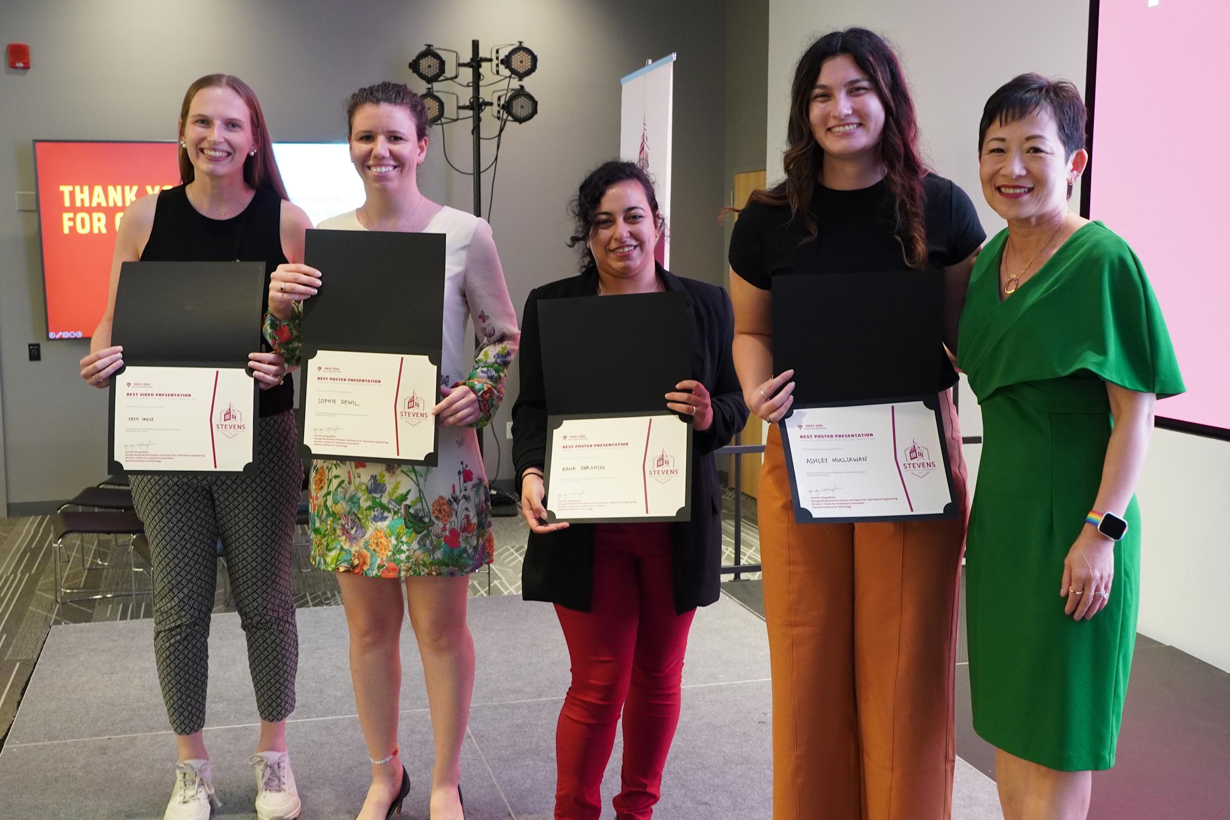 Winners Erin Kries, Sophie DeWitt, Rana Ibrahim and Ashley Muliawan pose with CHI Director Jennifer Kang-Mieler.