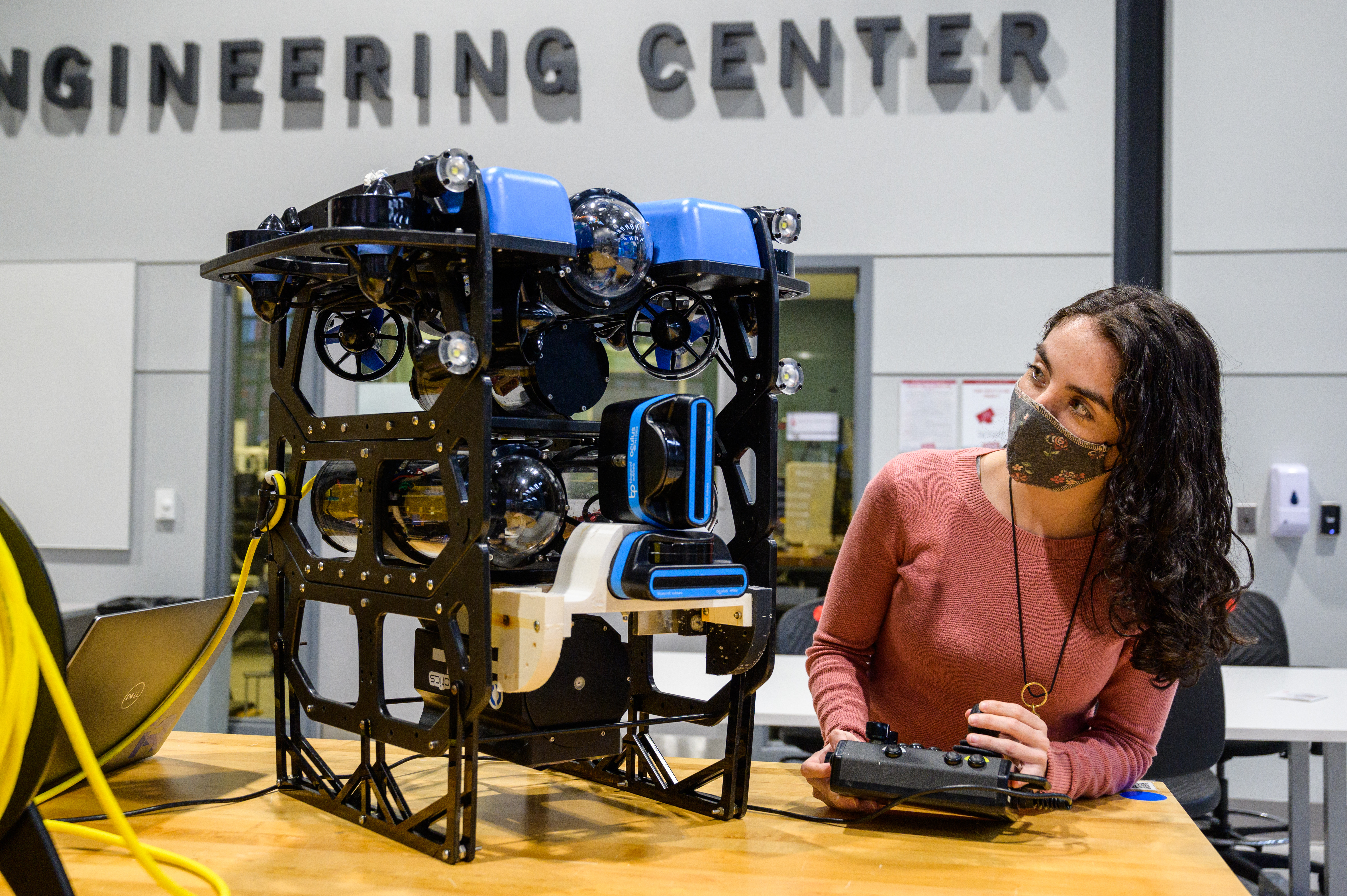 Student in lab works on underwater drone