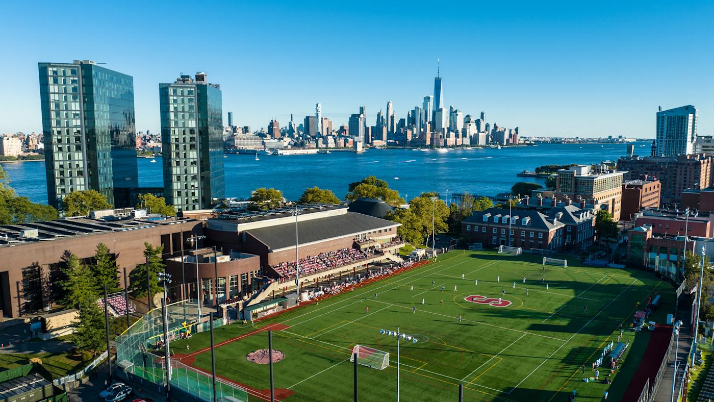 View of Stevens campus from above athletics field, with New York skyline in background