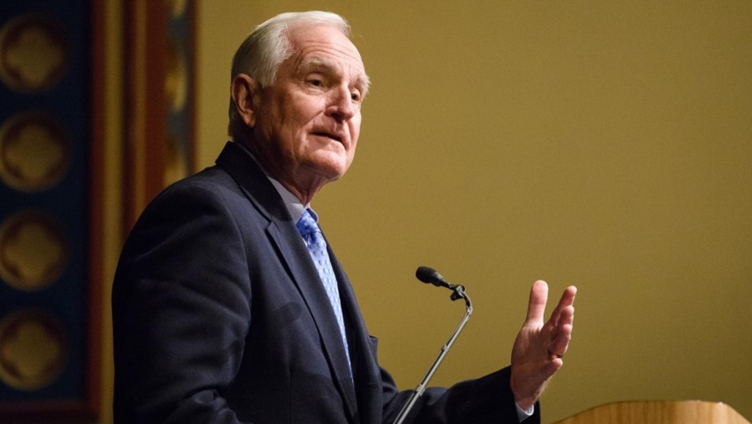 Dr. Craig Barrett giving a speech at a podium