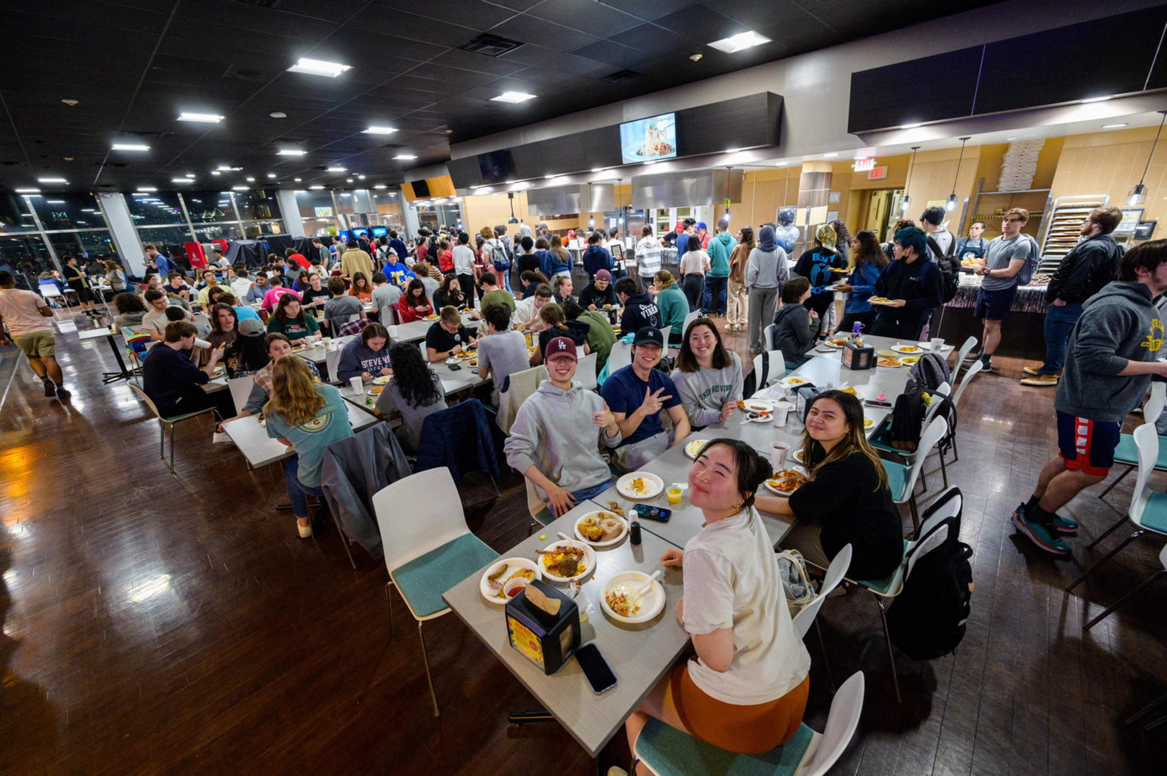 Large group of student eating in dining hall
