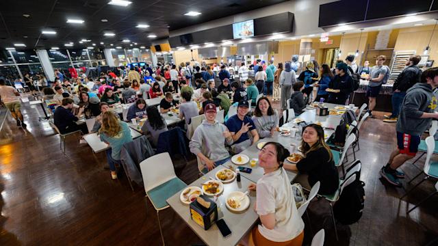 Large group of student eating in dining hall
