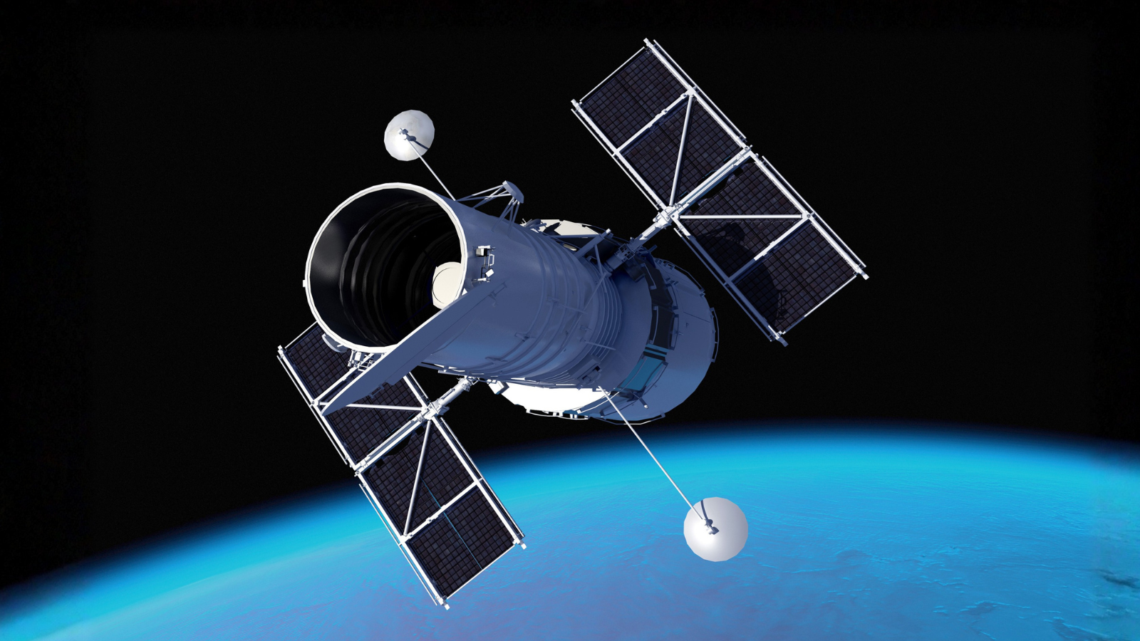 A photograph of the Hubble Space Telescope floating in outer space. 