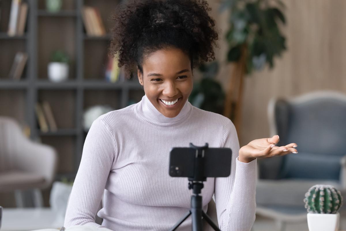 High school female recording video on iphone