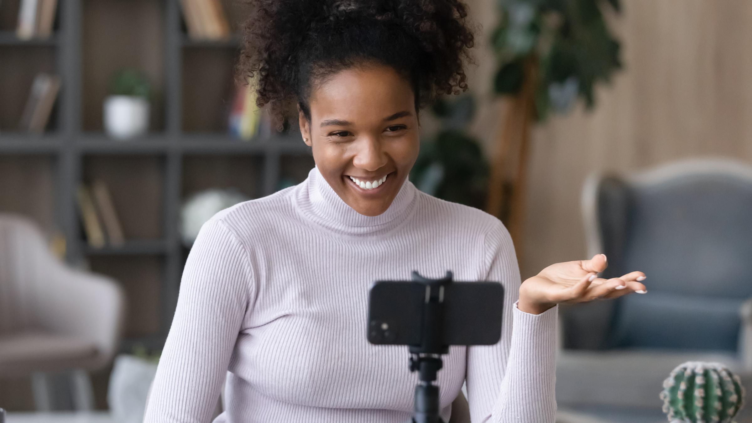 High school female recording video on iphone