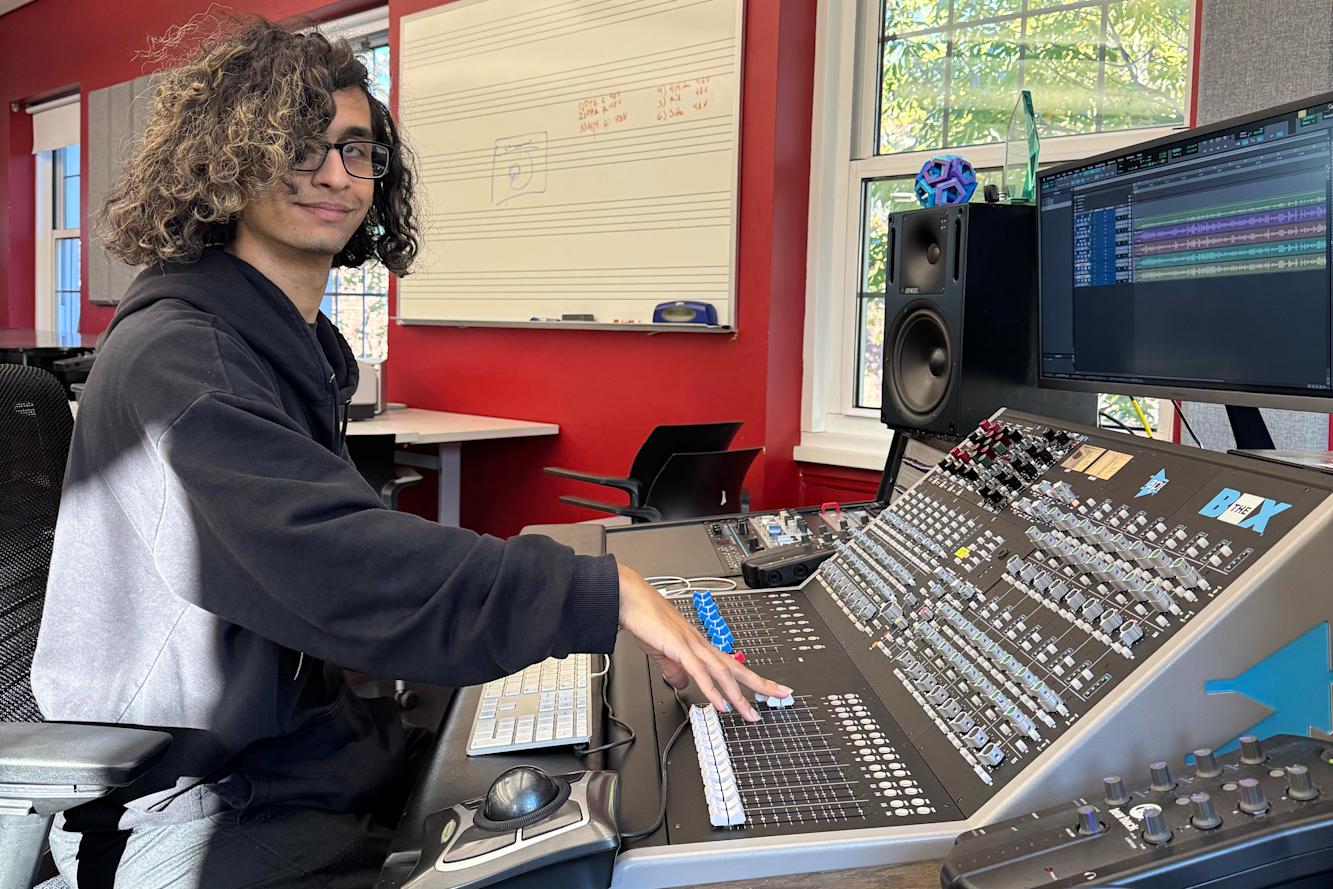 Student at a mixing board.