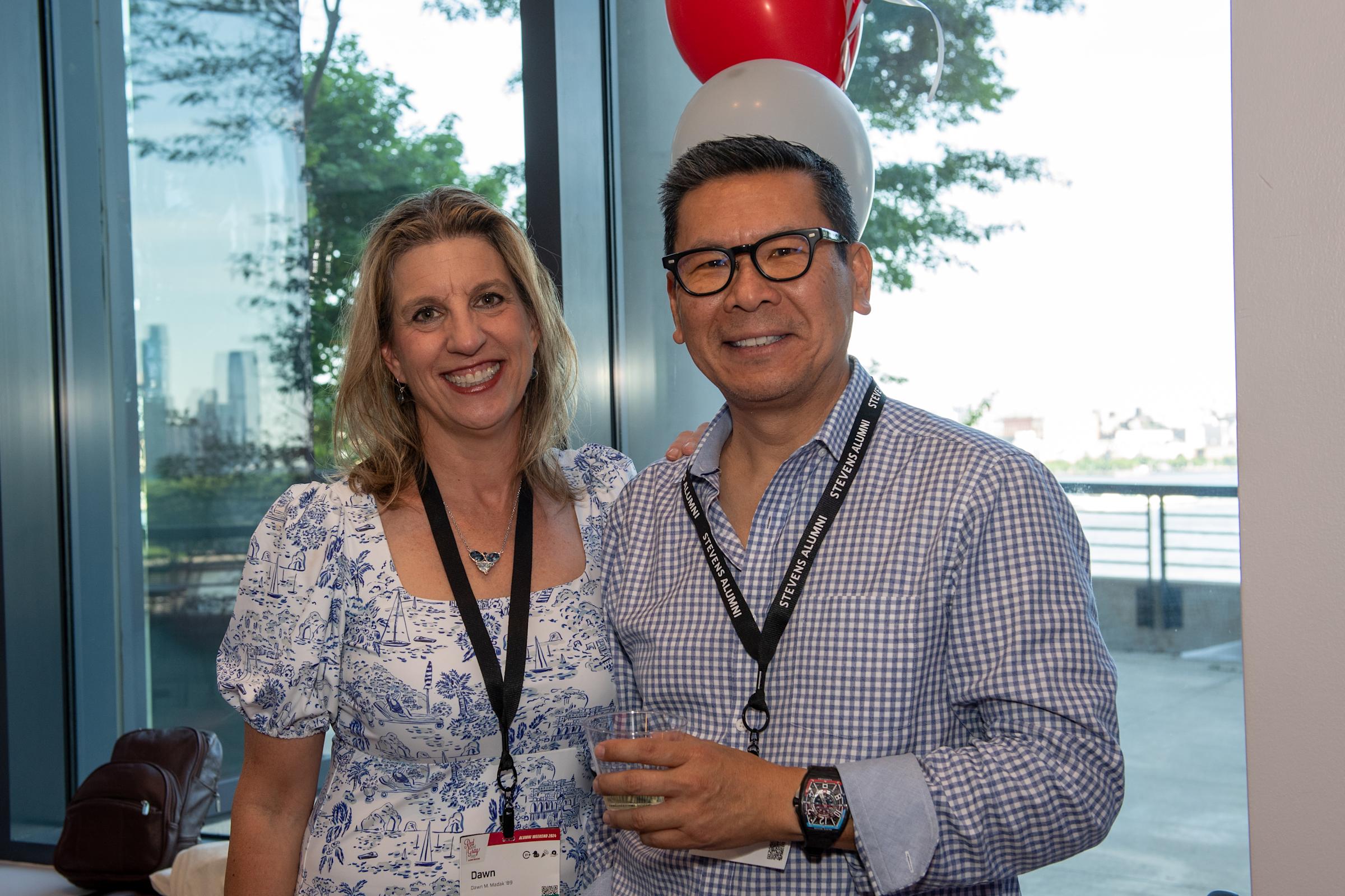 Two alumni volunteers pose for a picture at Alumni Weekend