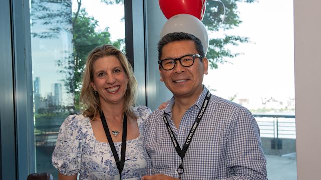 Two alumni volunteers pose for a picture at Alumni Weekend