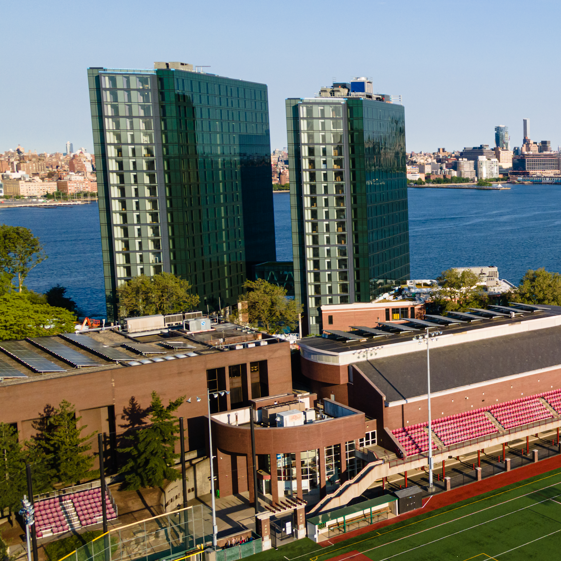 Aerial photo of the Stevens campus with the Manhattan skyline in the background