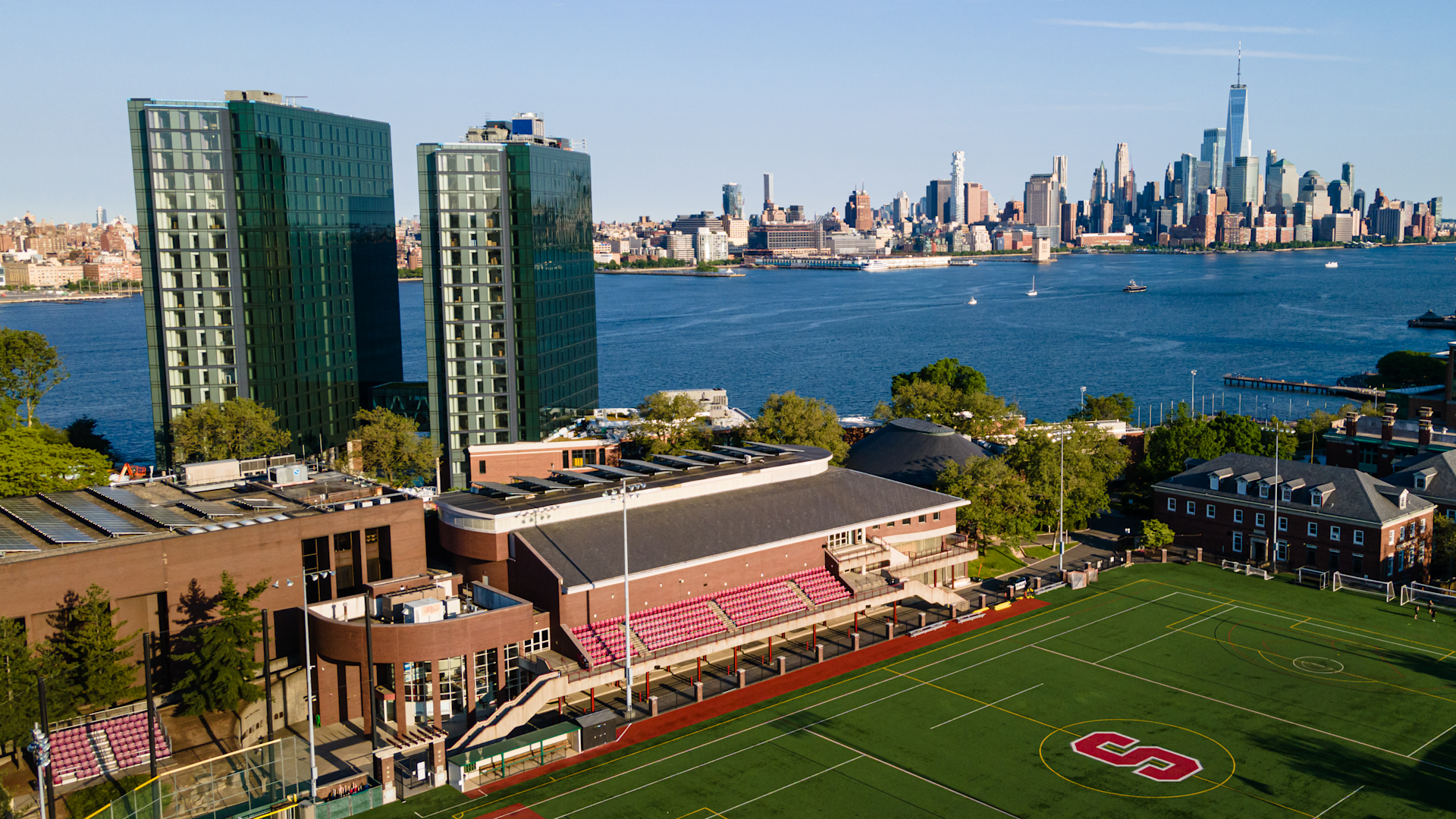 Aerial photo of the Stevens campus with the Manhattan skyline in the background