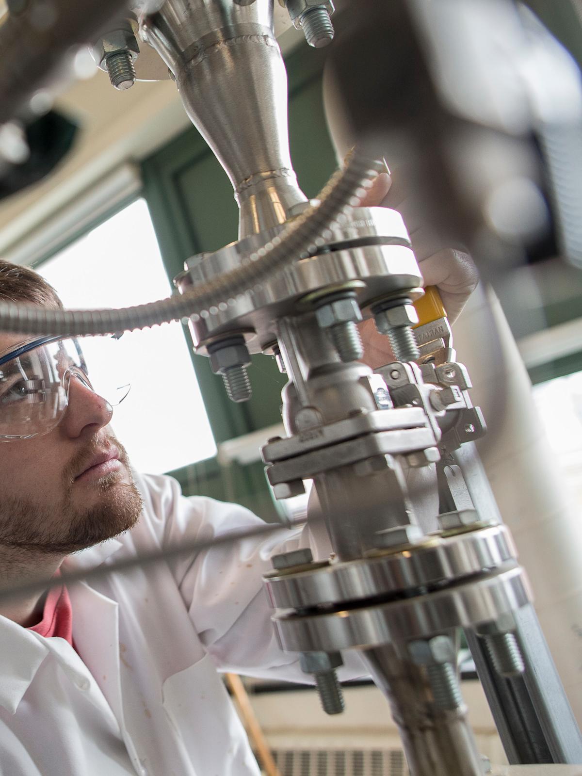 Chemical Engineering and Materials Science student working with machinery.