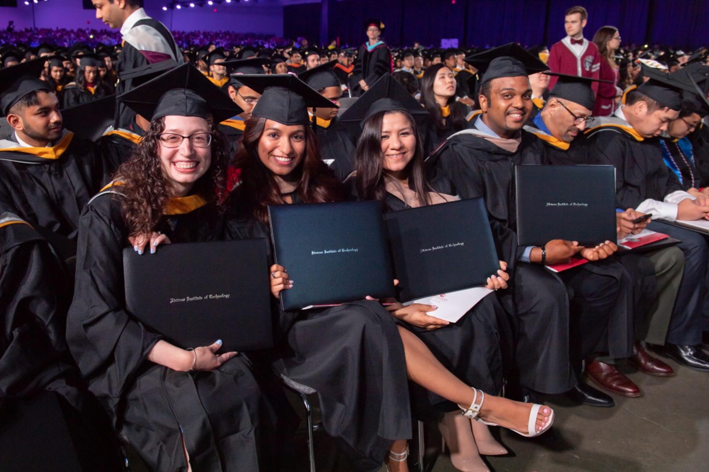 Class of 2018 students seated in the arena