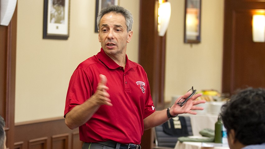 Dr. Peter Dominick teaching in a corporate boardroom in the Thayer Hotel, in West Point, NY.