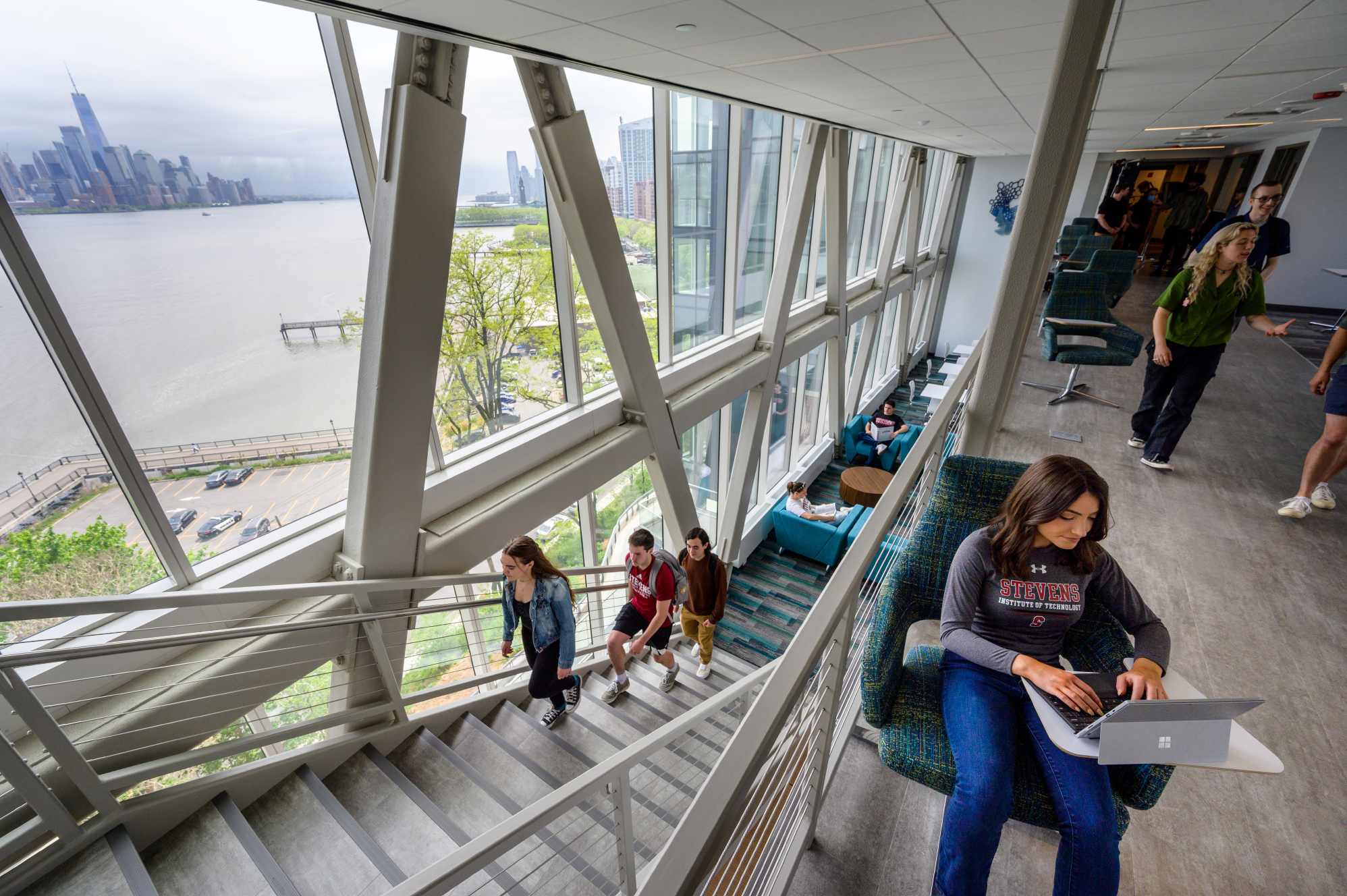 Students socialize in the skybridge area of the UCC.