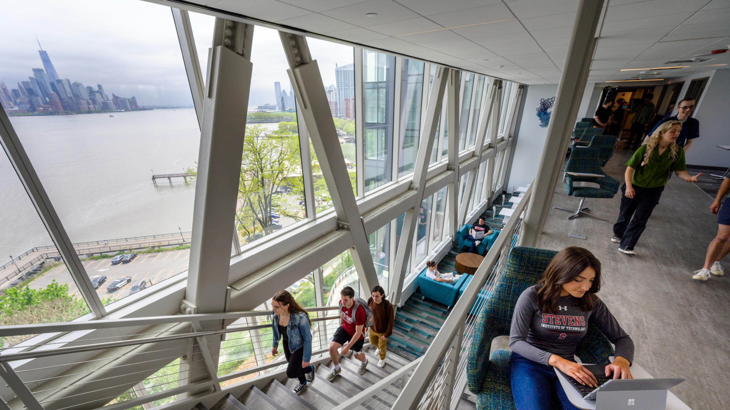 Students socialize in the skybridge area of the UCC.