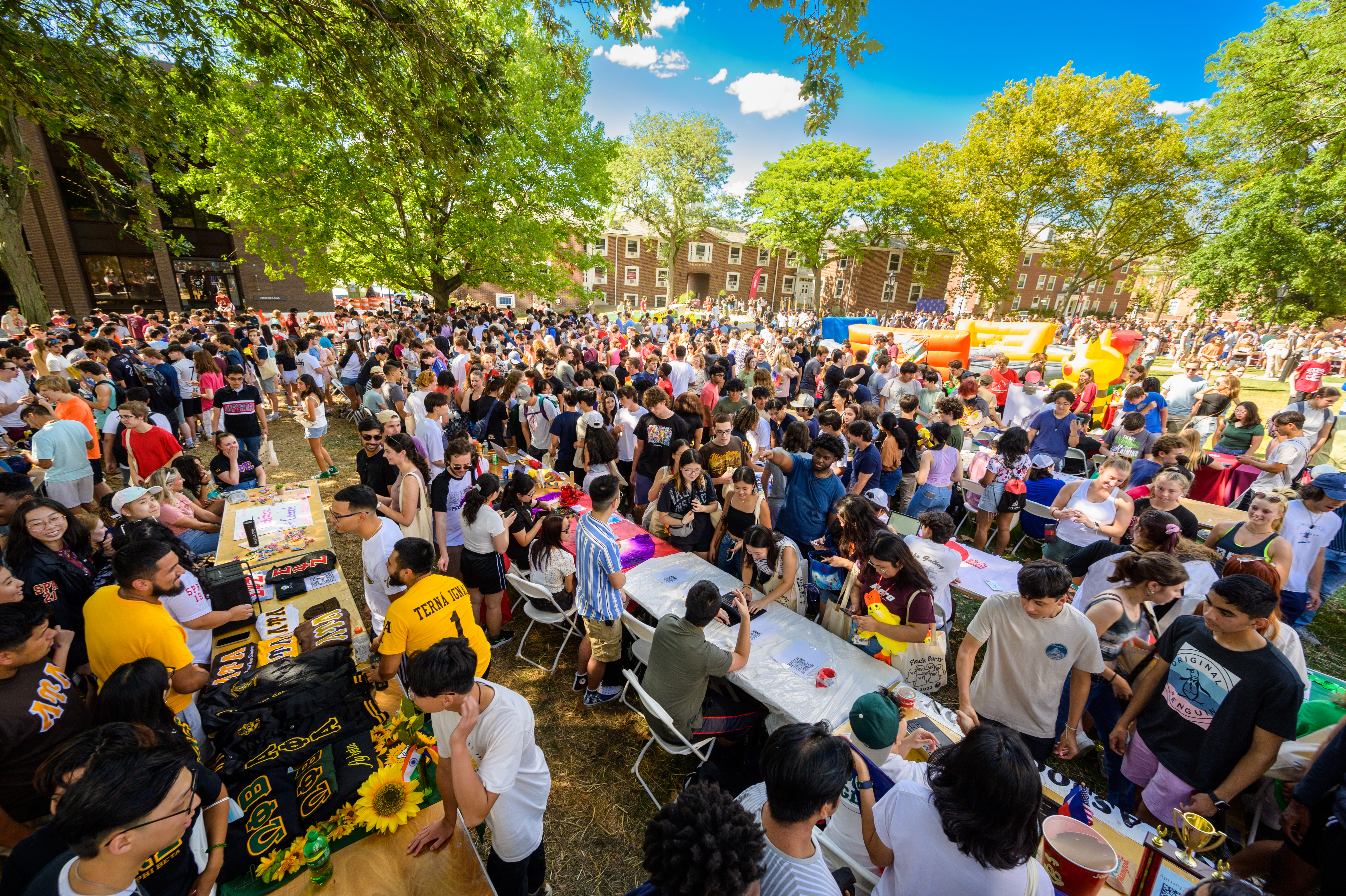 Crowd of people on campus at Flock Party Student Involvement Fair